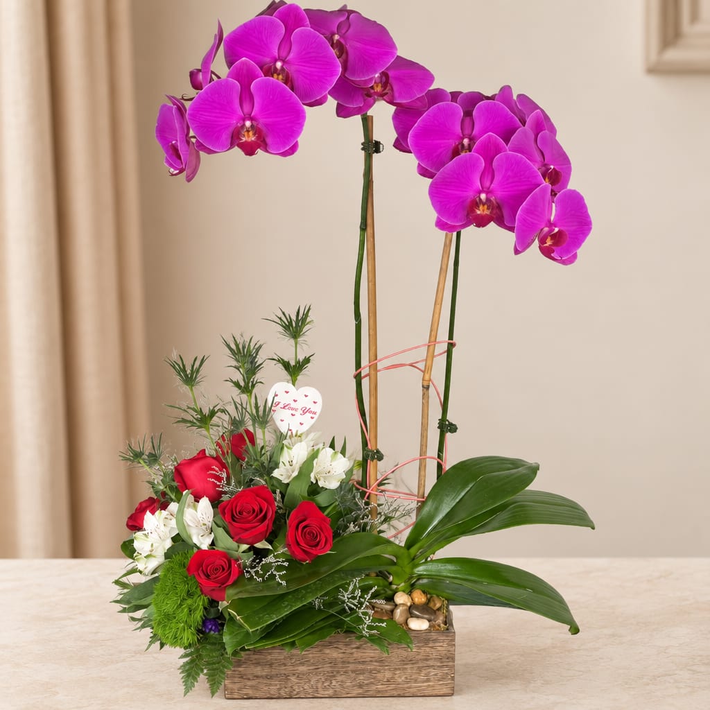 Orchid and rose arrangement in a wooden box with a heart pick
