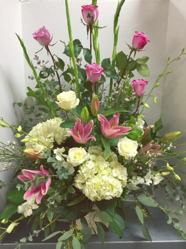 Tall bouquet with pink roses, lilies, and white hydrangeas