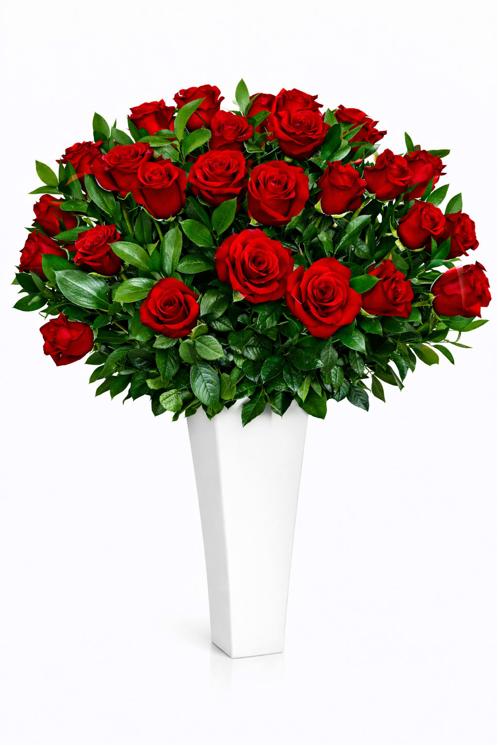 Bouquet of red roses in a tall white vase