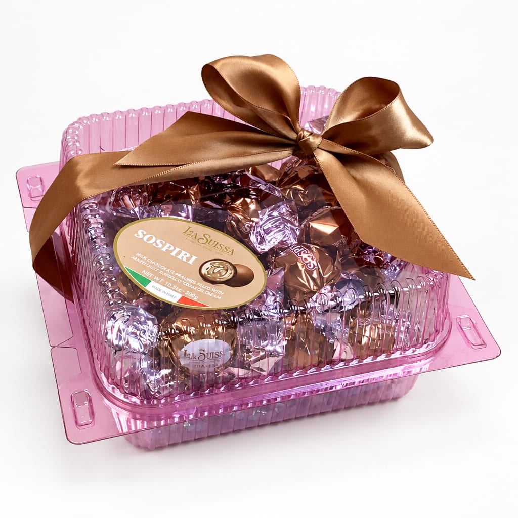 Pink gift box of assorted chocolates tied with a brown satin bow