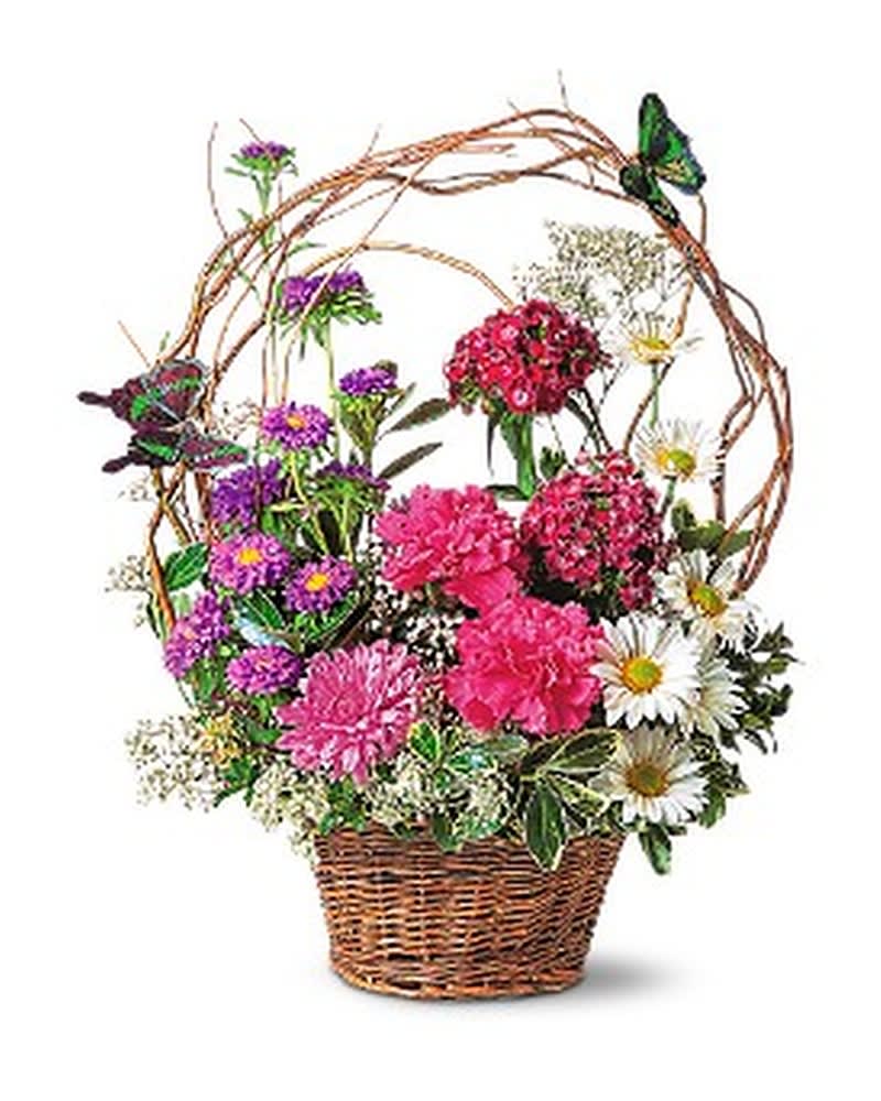 Basket arrangement of pink and purple flowers with white daisies