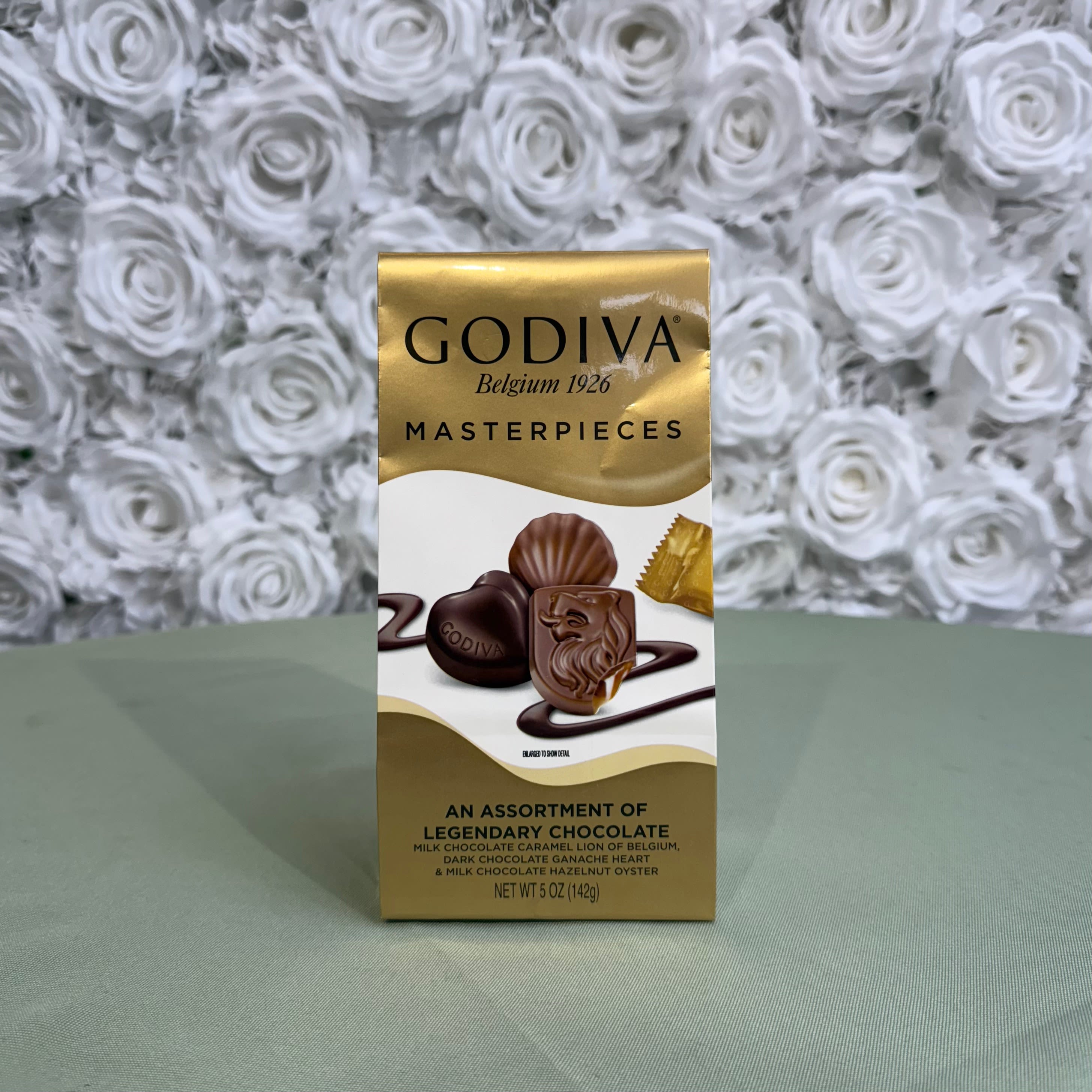A box of Godiva assorted chocolates on a table.