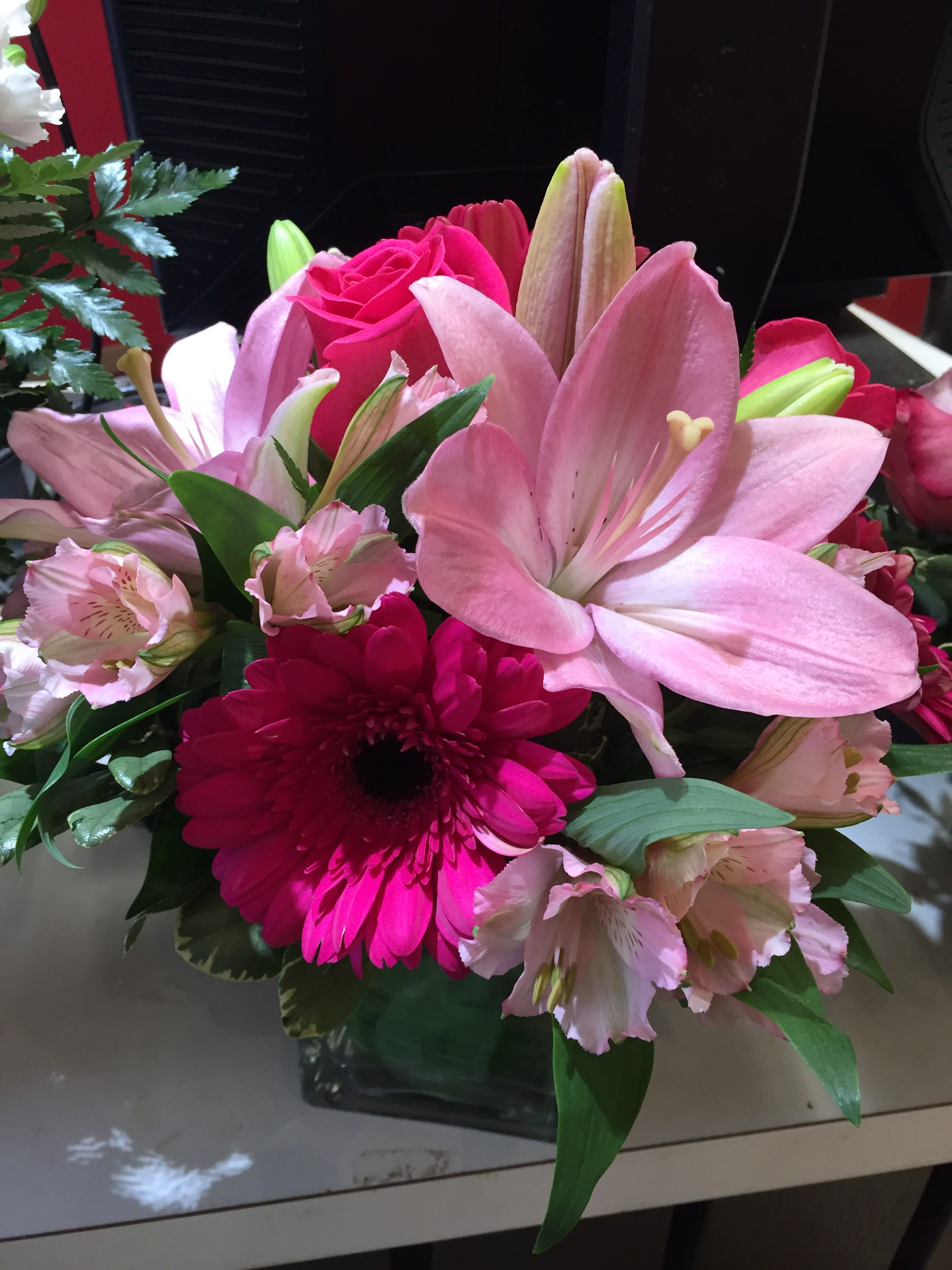 Pink lilies and gerbera daisies in a mixed bouquet