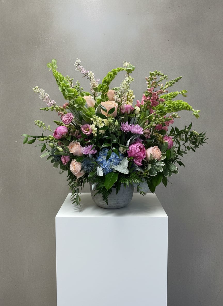 In Loving Memory  - A heartfelt expression of sympathy celebrating a life whose love and memories continue to bloom in the hearts of those left behind.  This piece is appropriate for both the service or the residence. 