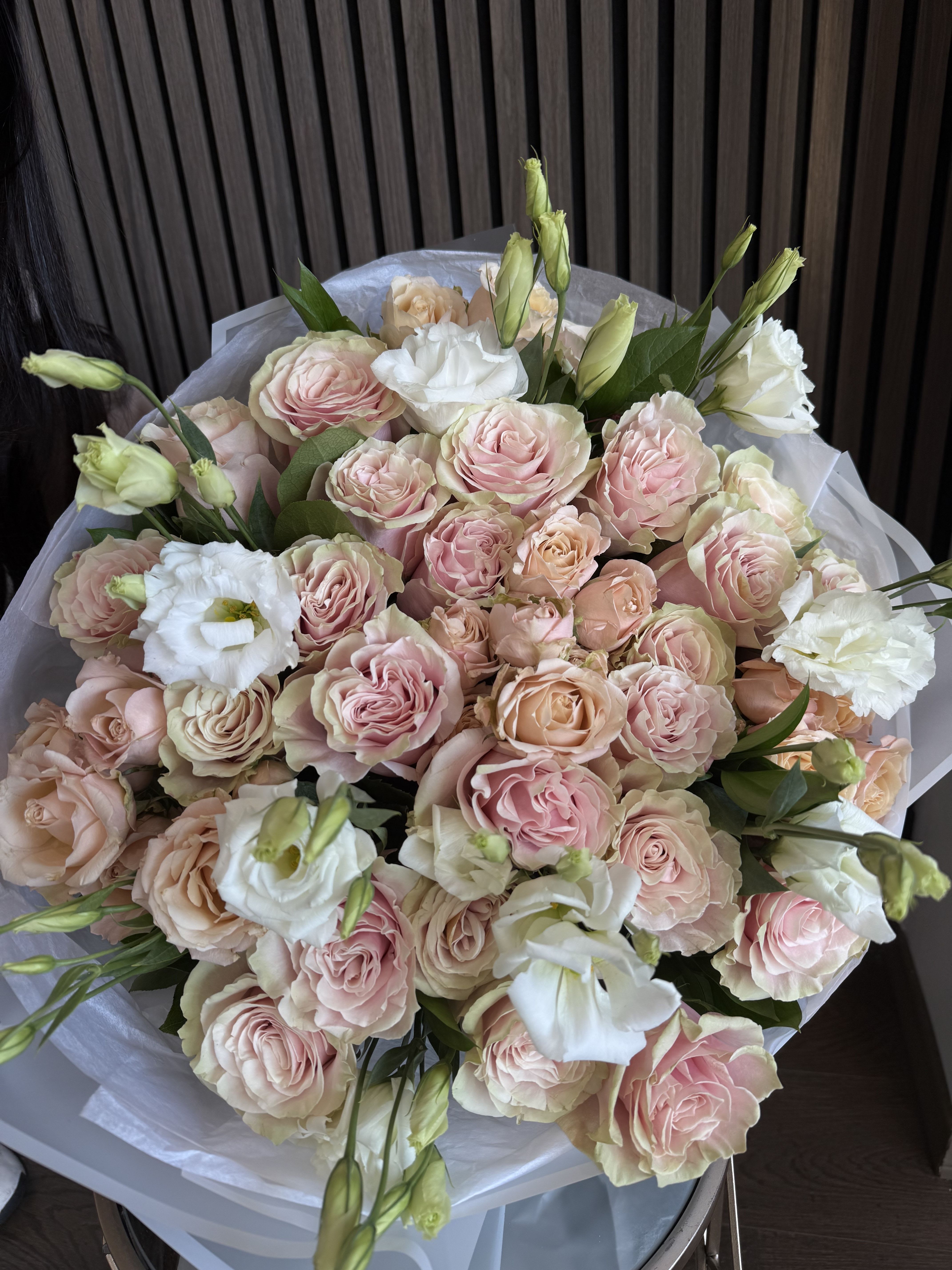 Bouquet of pale pink and white roses with white lisianthus