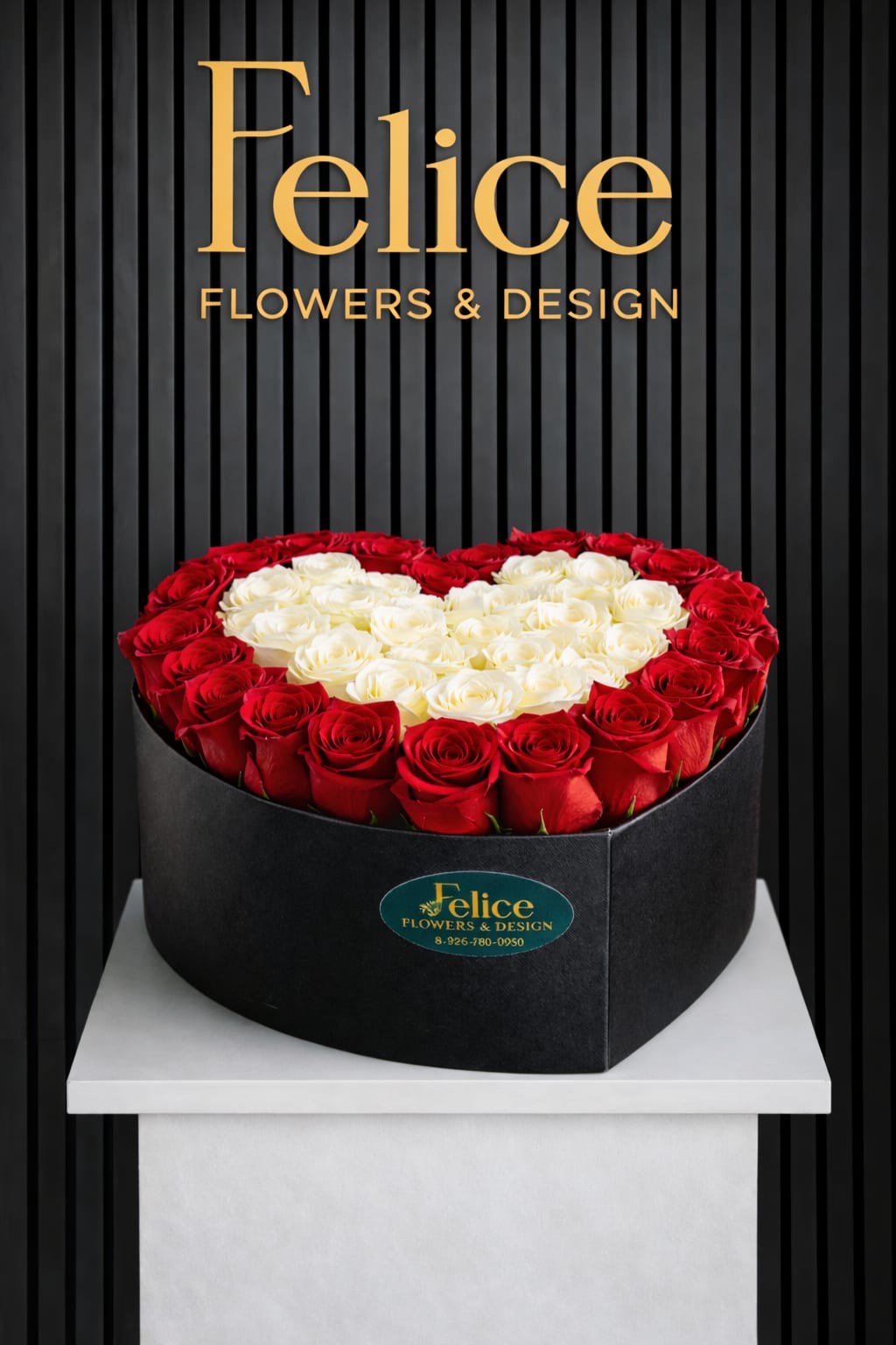 Heart-shaped box of red and white roses