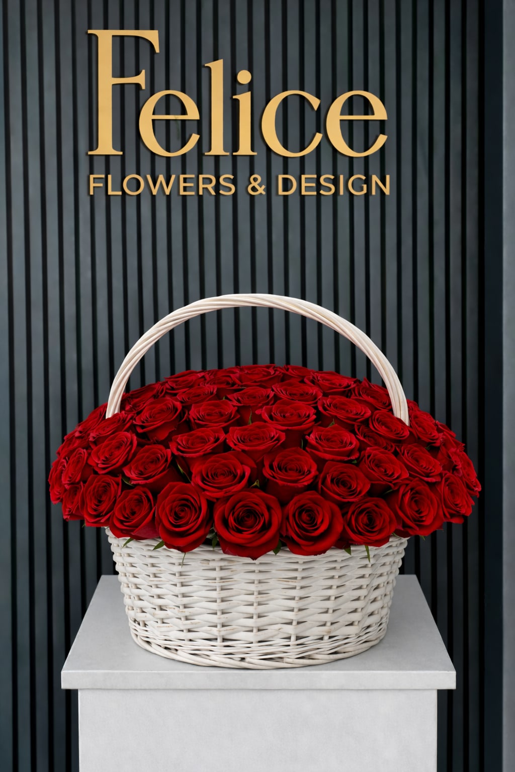 Basket of red roses with a white handle