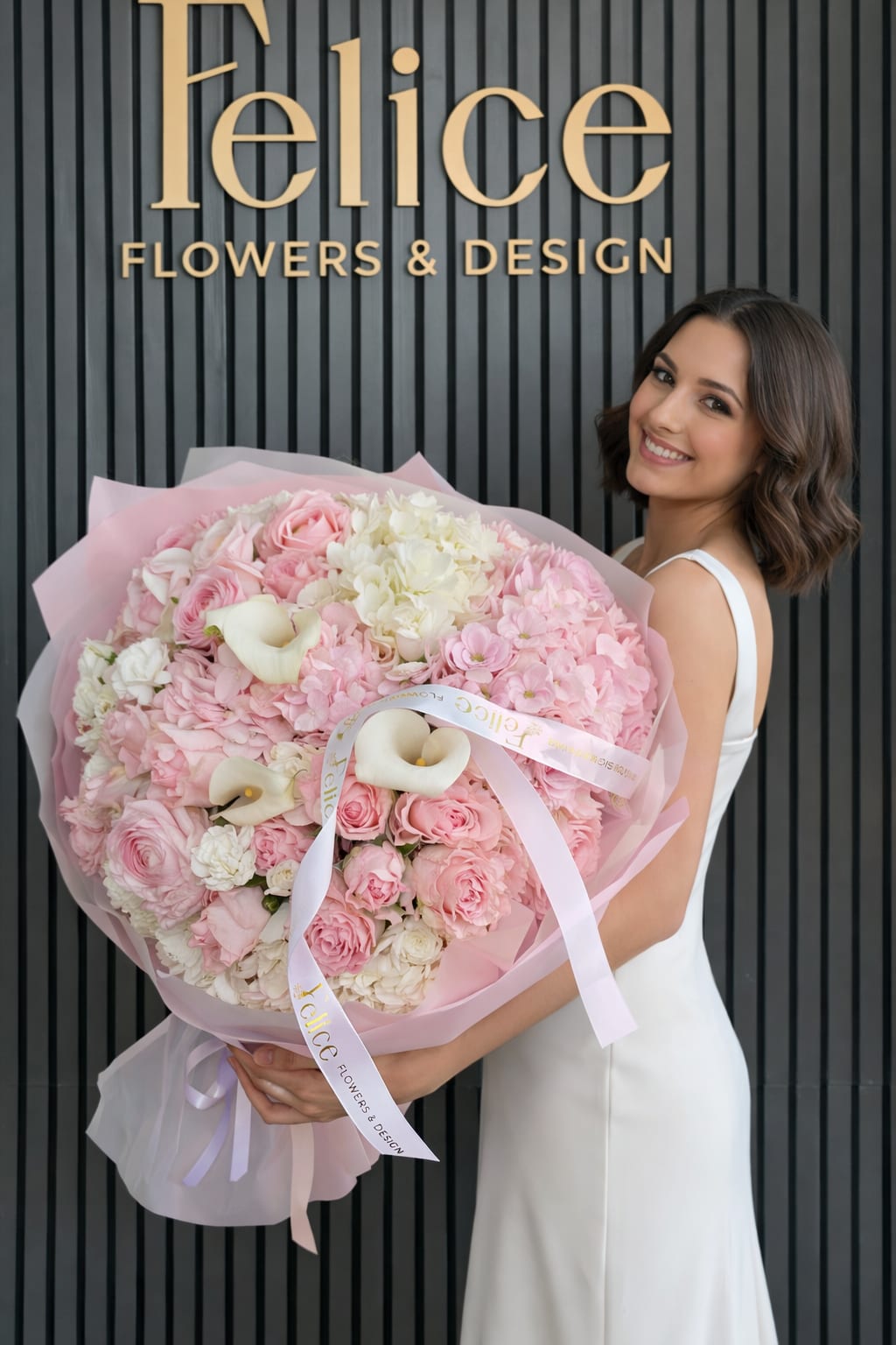 Large pink bouquet with roses, hydrangeas, and white calla lilies