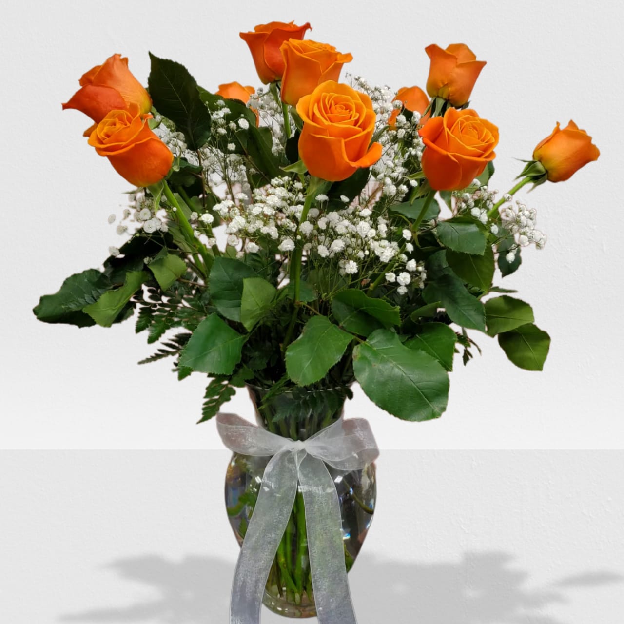 Dozen orange roses - Brighten someone's day with a touch of color, perfect for summer. Standar size 12, deluxe size 18 and premium size 24 roses.