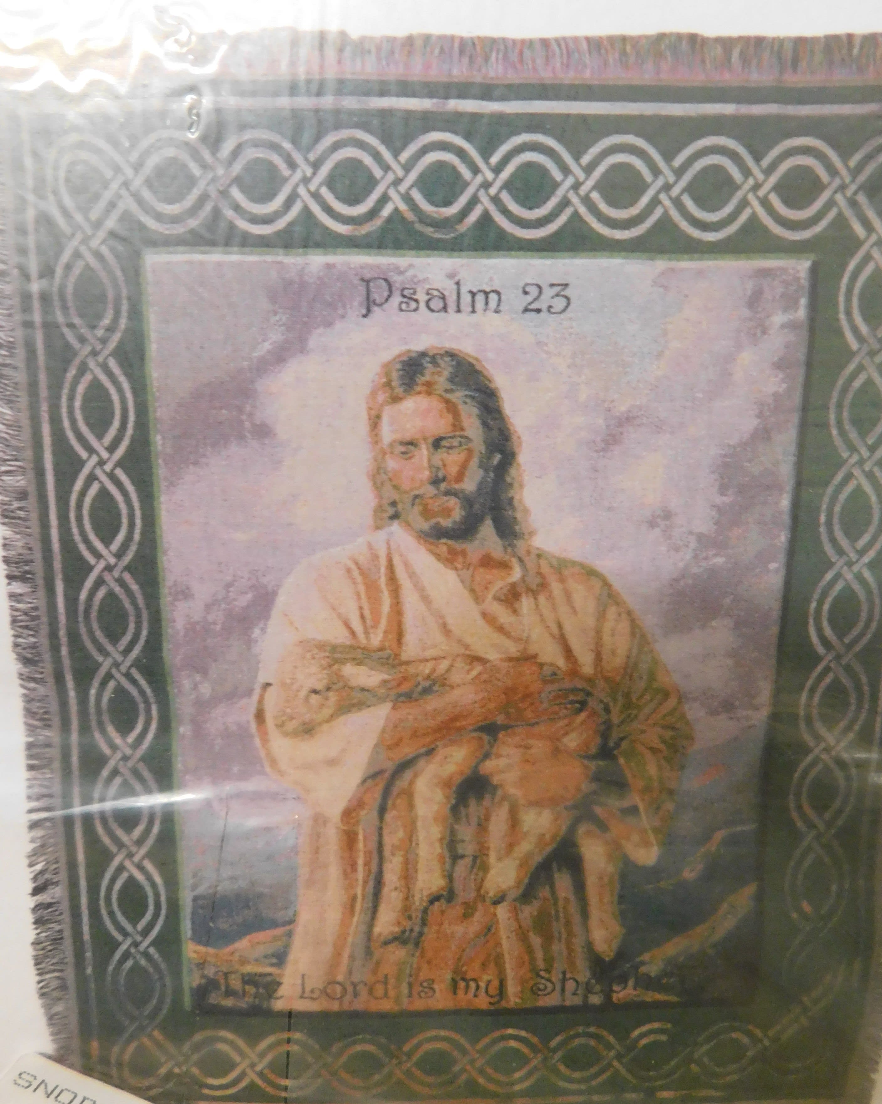 Framed religious wall hanging with Psalm 23 and an image of Jesus