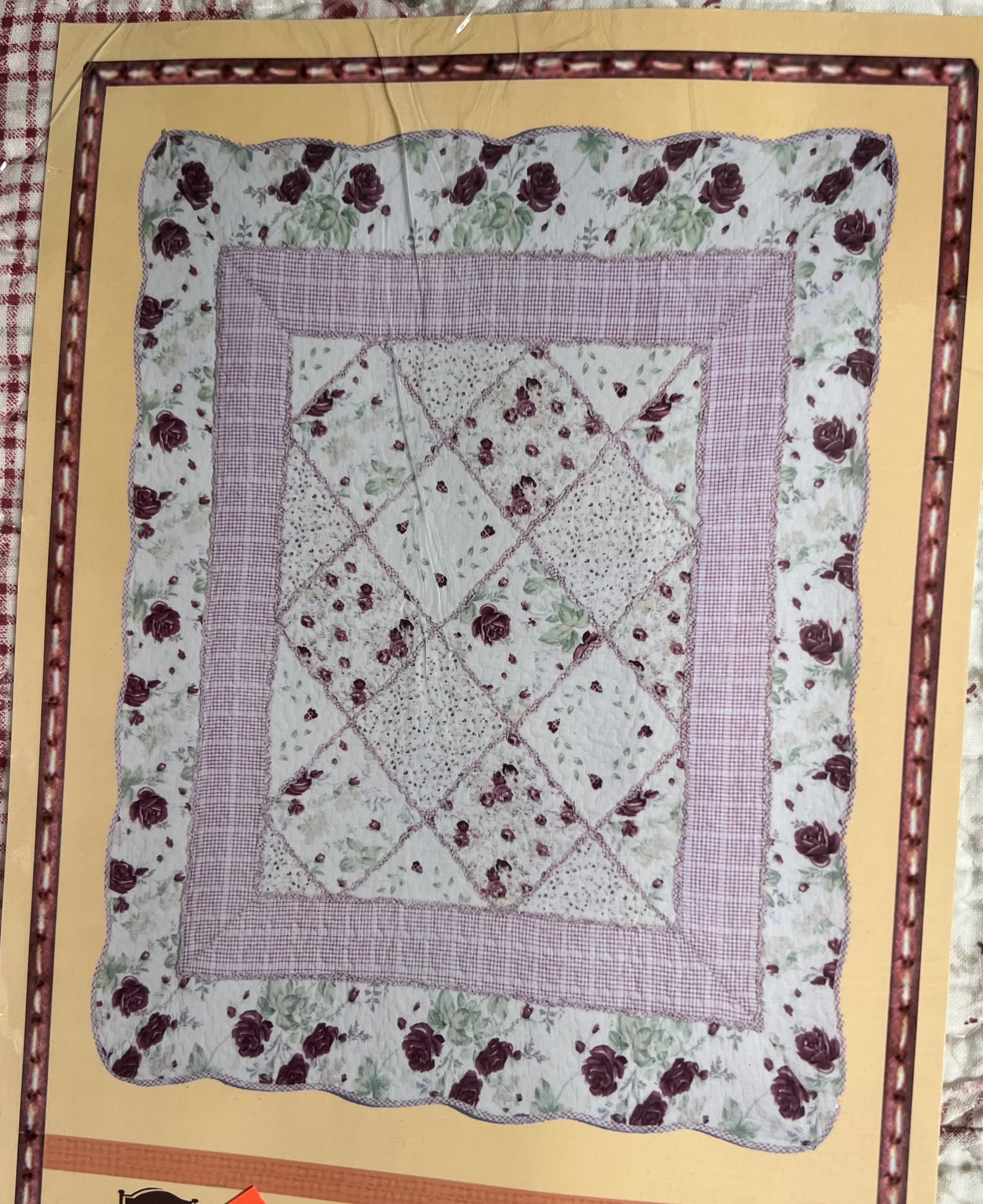 Floral patchwork quilt with pink and burgundy rose prints
