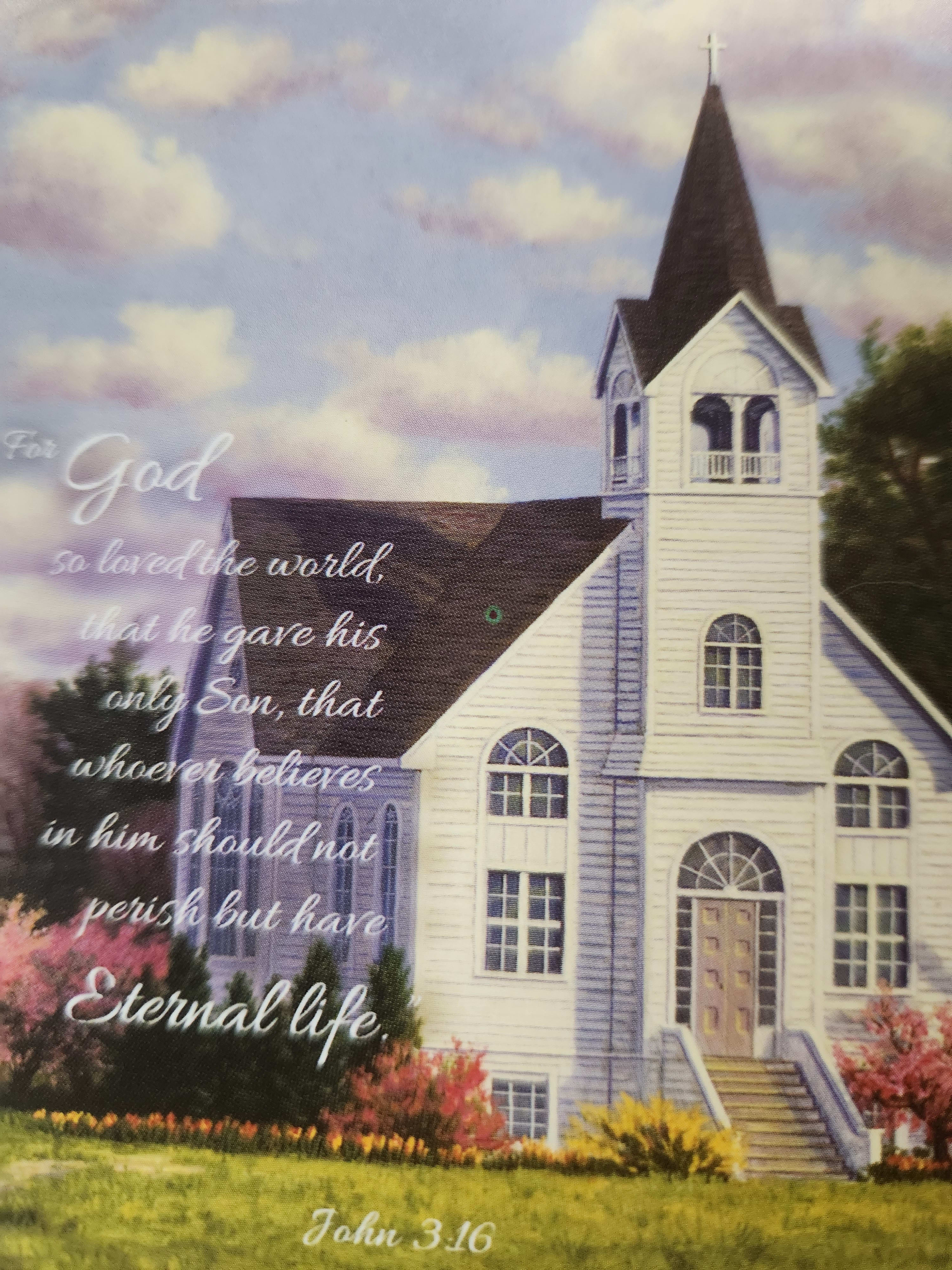 Church building with a Bible verse over a cloudy sky background