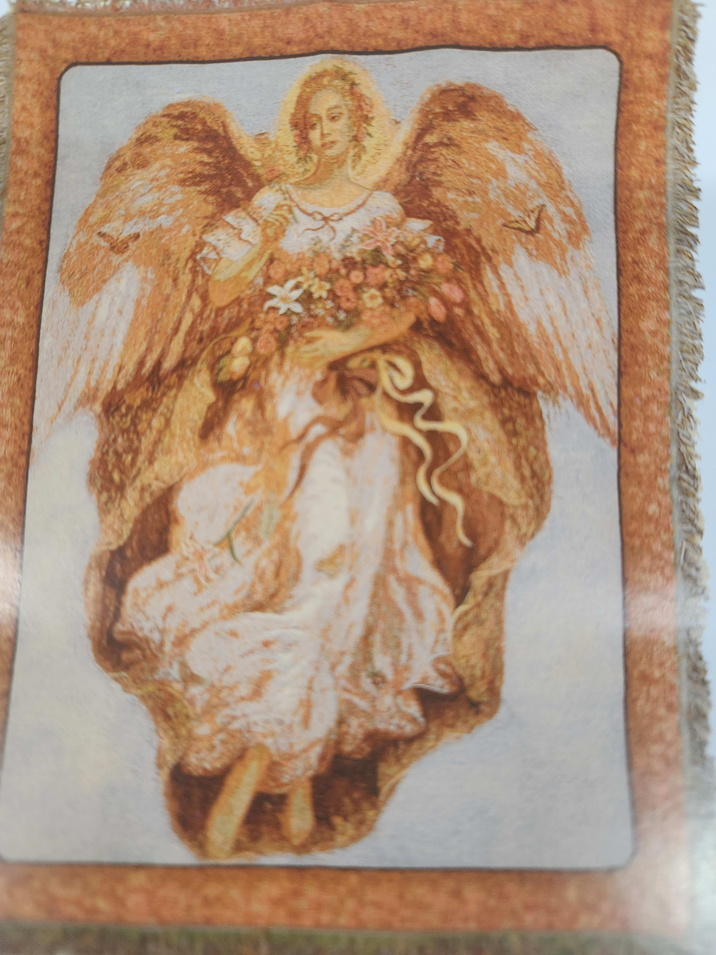 Decorative angel figure holding a bouquet of flowers