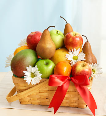 Fruit basket with apples, pears, and daisies tied with a red ribbon