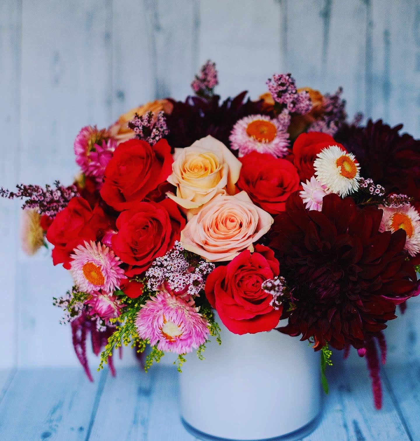 Shades of pink - A beautiful blend of roses, dahlias, asters and seasonal mix flowers.