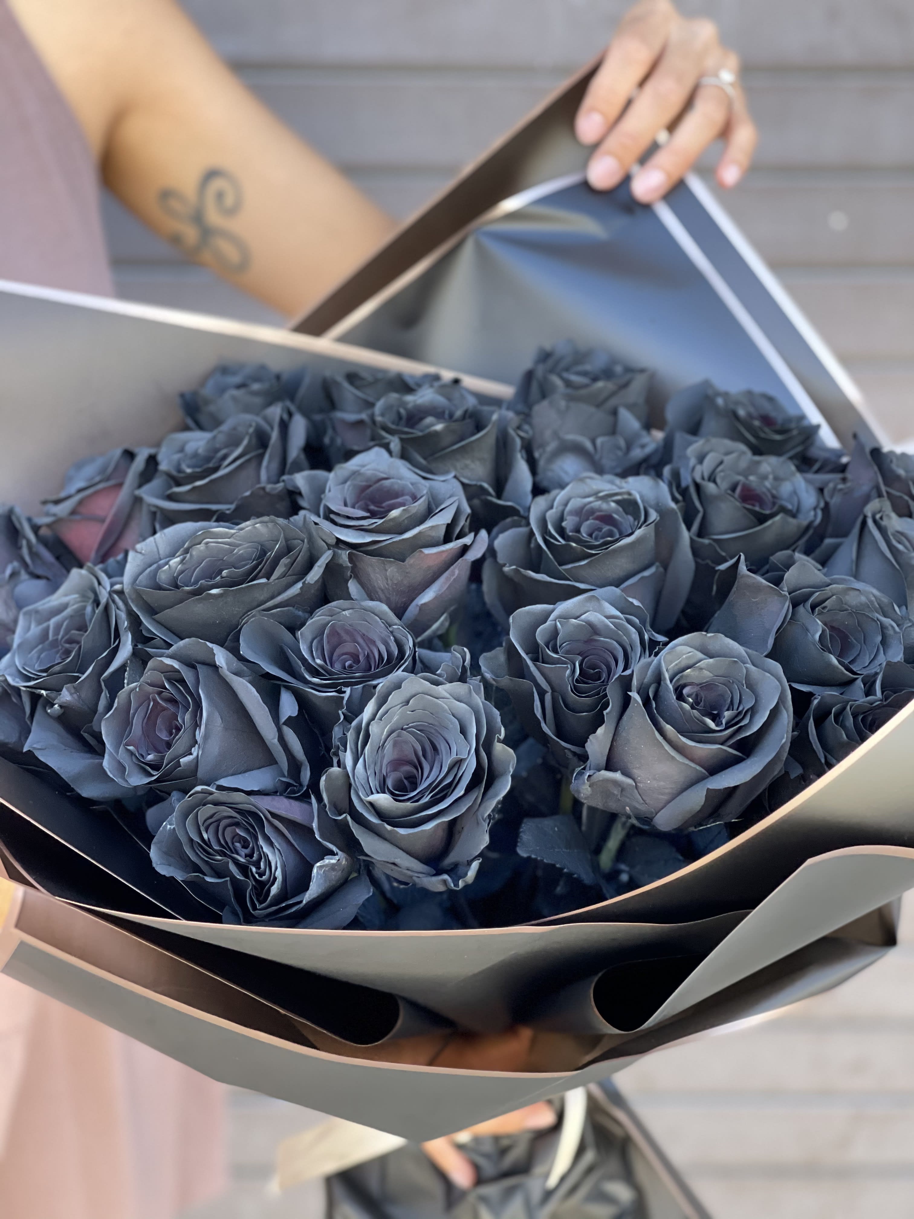 Black roses wrapped bouquet. - 25 Black roses wrapped