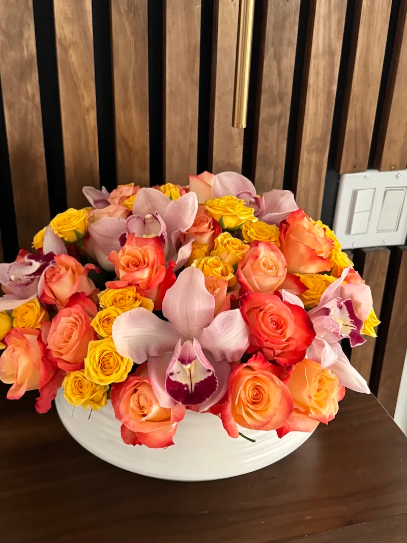 Sunshine bunch -  Colorful  orange roses and cymbidium orchids. Perfect gift for Mother day.
