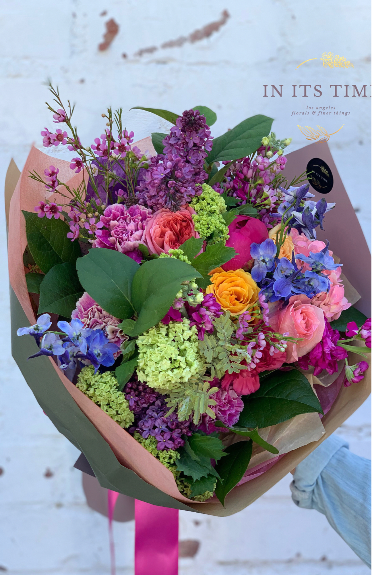 Over The Rainbow Wrapped Bouquet - Wrapped bouquet featuring lush bright colors and gorgeous blooms
