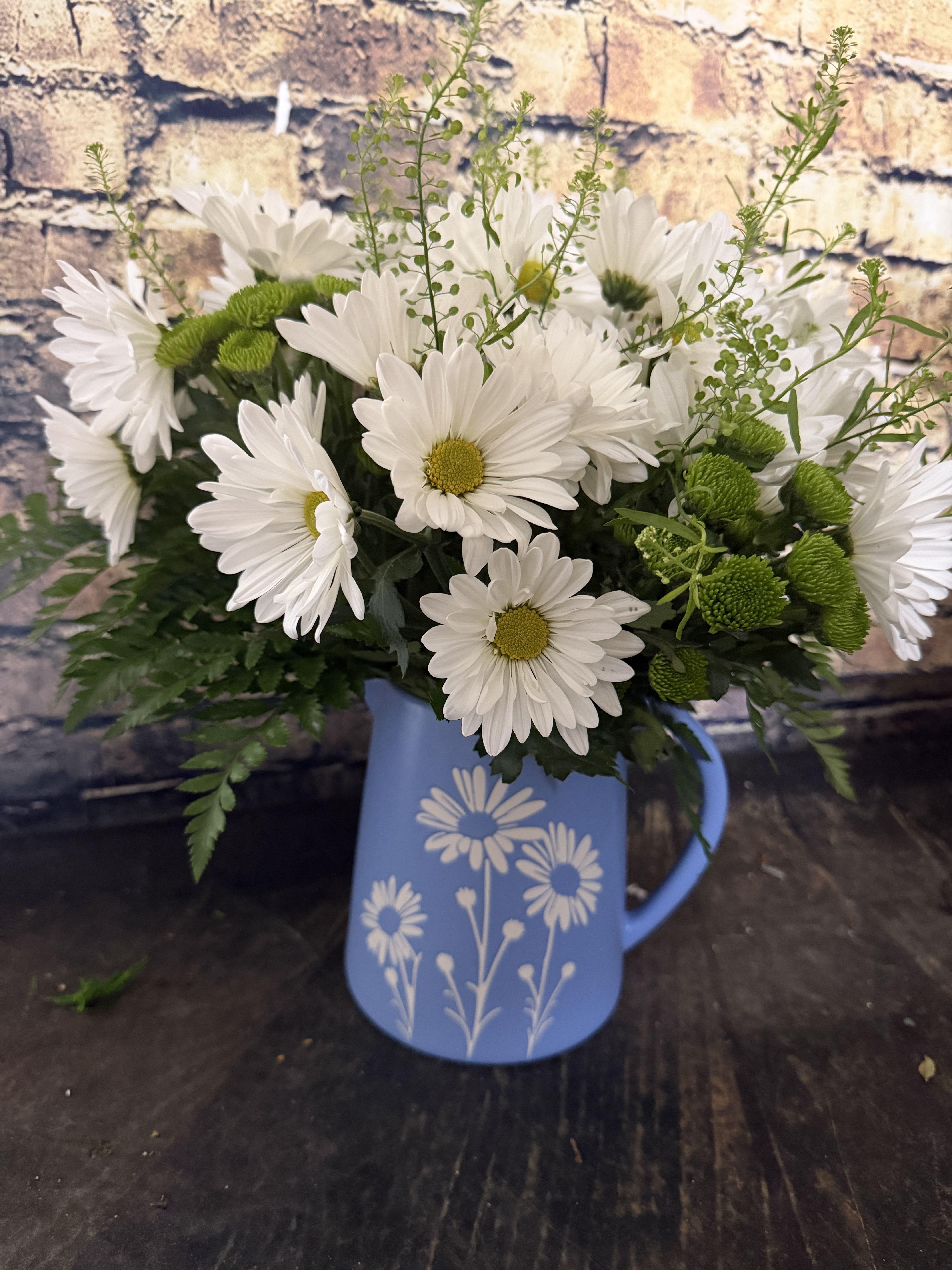 Daisy Daze Pitcher - A sparkling glass vase overflowing with sun-kissed daisies is a sure-fire way to brighten anyone's day!