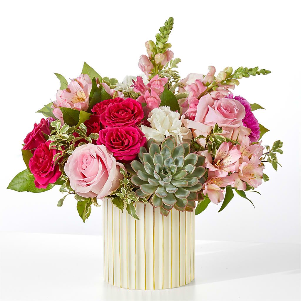 Magenta Musings Bouquet - Pale pink roses are combined with pops of hot pink to craft an energetic and compassionate gift for your friends or family.  2 Pink Snapdragon stems 2 Pink Alstroemeria stems 2 White Standard Carnations 3 Pink 50 cm Roses 2 Pink Standard Carnation 1 Succulent 1 Hot Pink Spray Rose stem 2 Salal tips 1 Italian Variegated Pittosporum stem