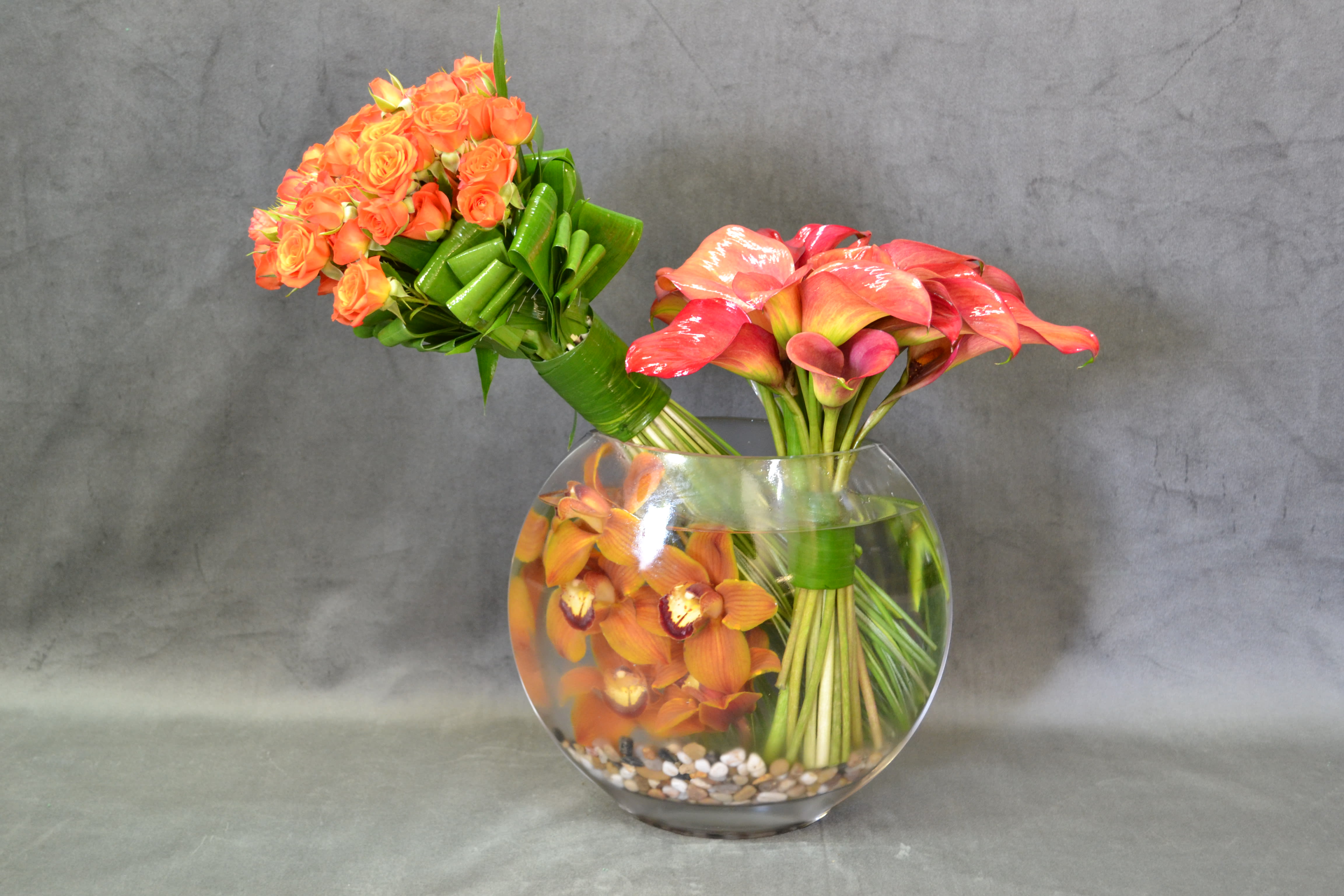 The victory - Make that person happy, with this vase with spray roses, calla lilies and cymbidium orchids