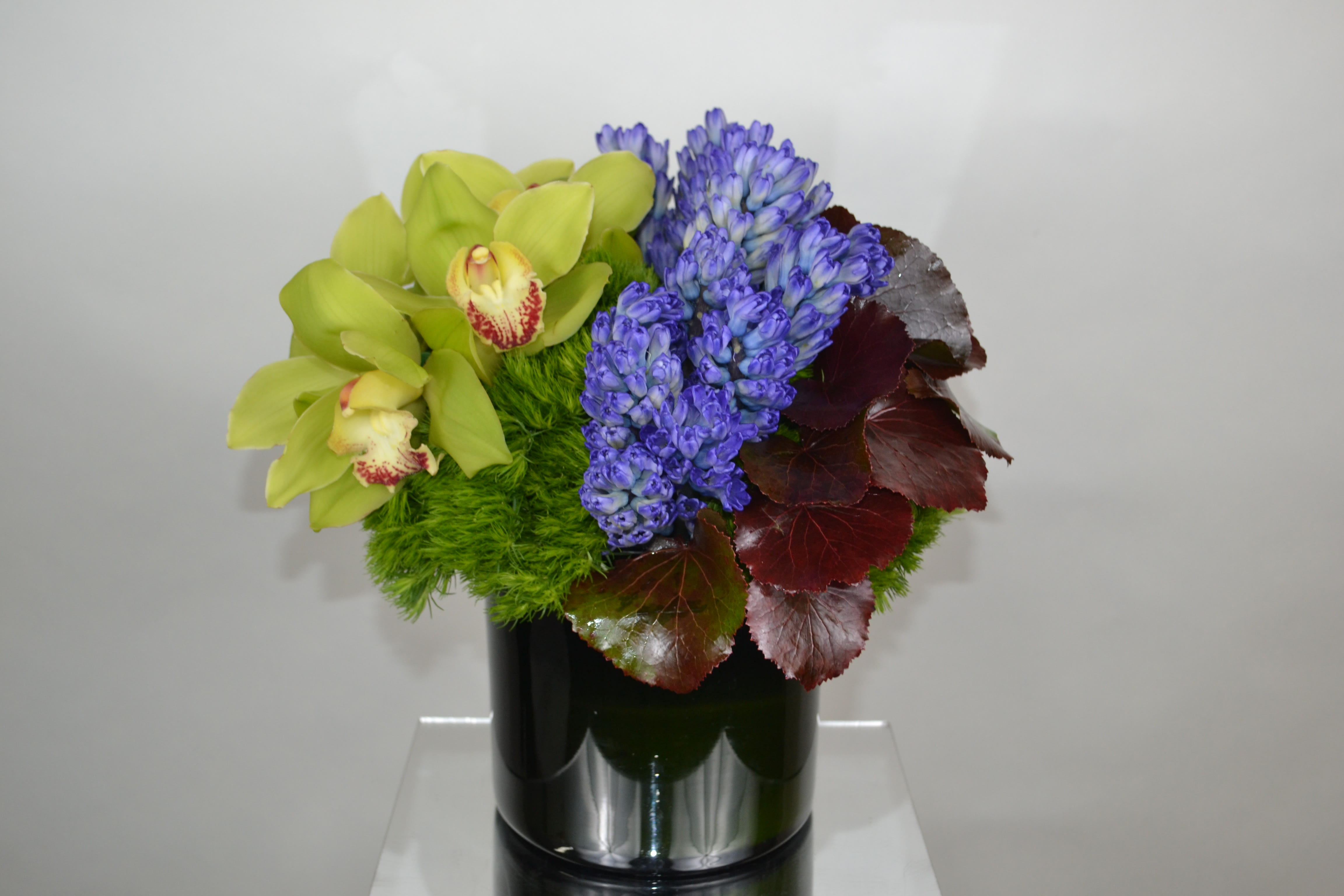Meadow Spring  - Assorted flowers, orchids, hyndrengeas and green dianthus. 