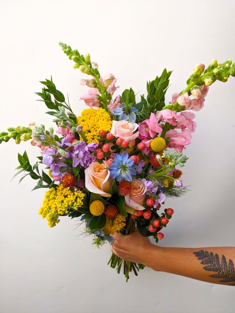 Bright Floral Wrap  - Bright, seasonal blooms picked by the designer. This wrap is colorful with a wildflower touch. It will arrive beautifully wrapped in paper for you to place in a vase. 