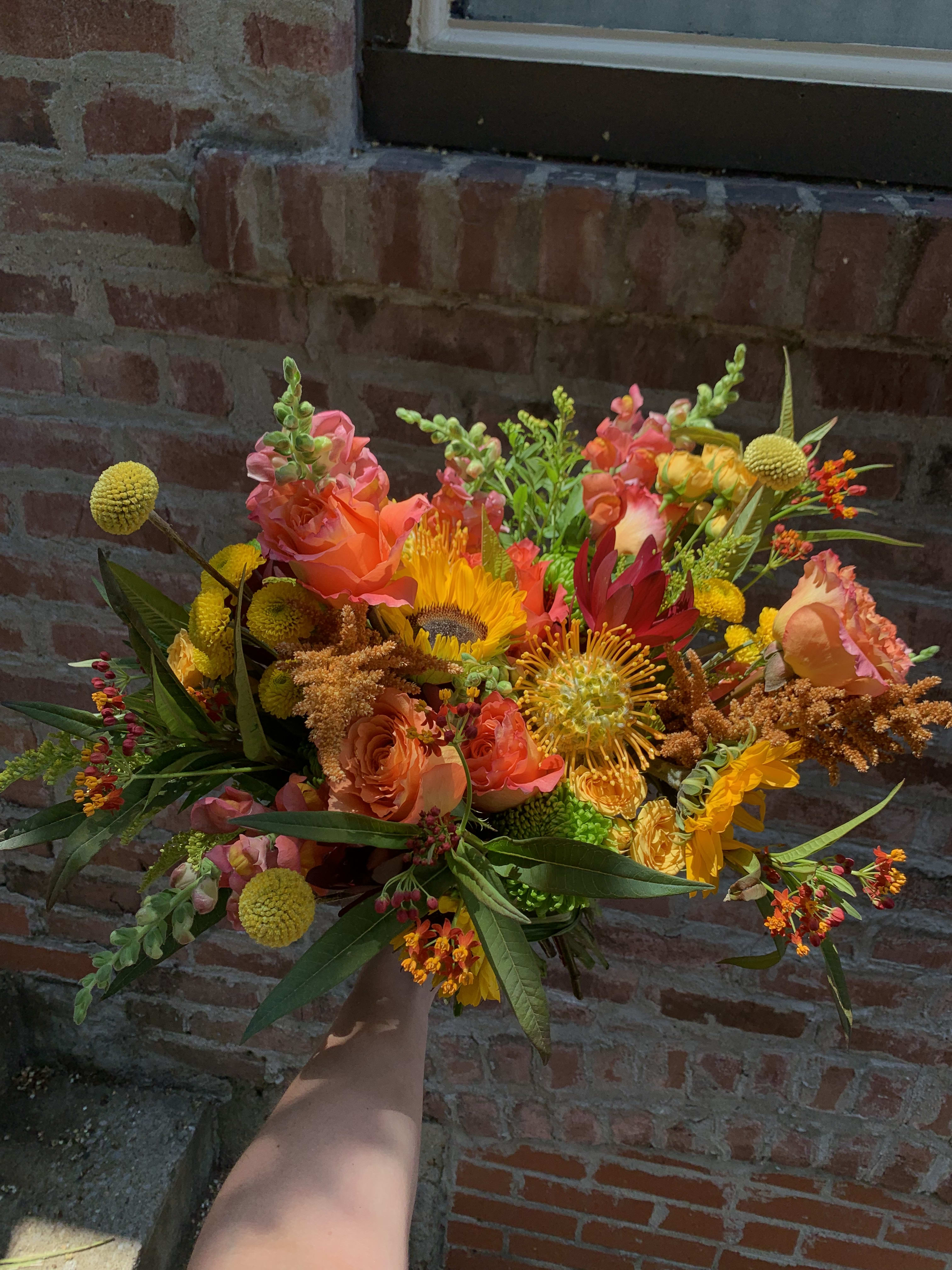 Colorful, Playful, and Fun Bouquet  - Colorful pincushion protea and free spirit roses make this arrangement pop! It will brighten anyone’s day and will make a great gift.
