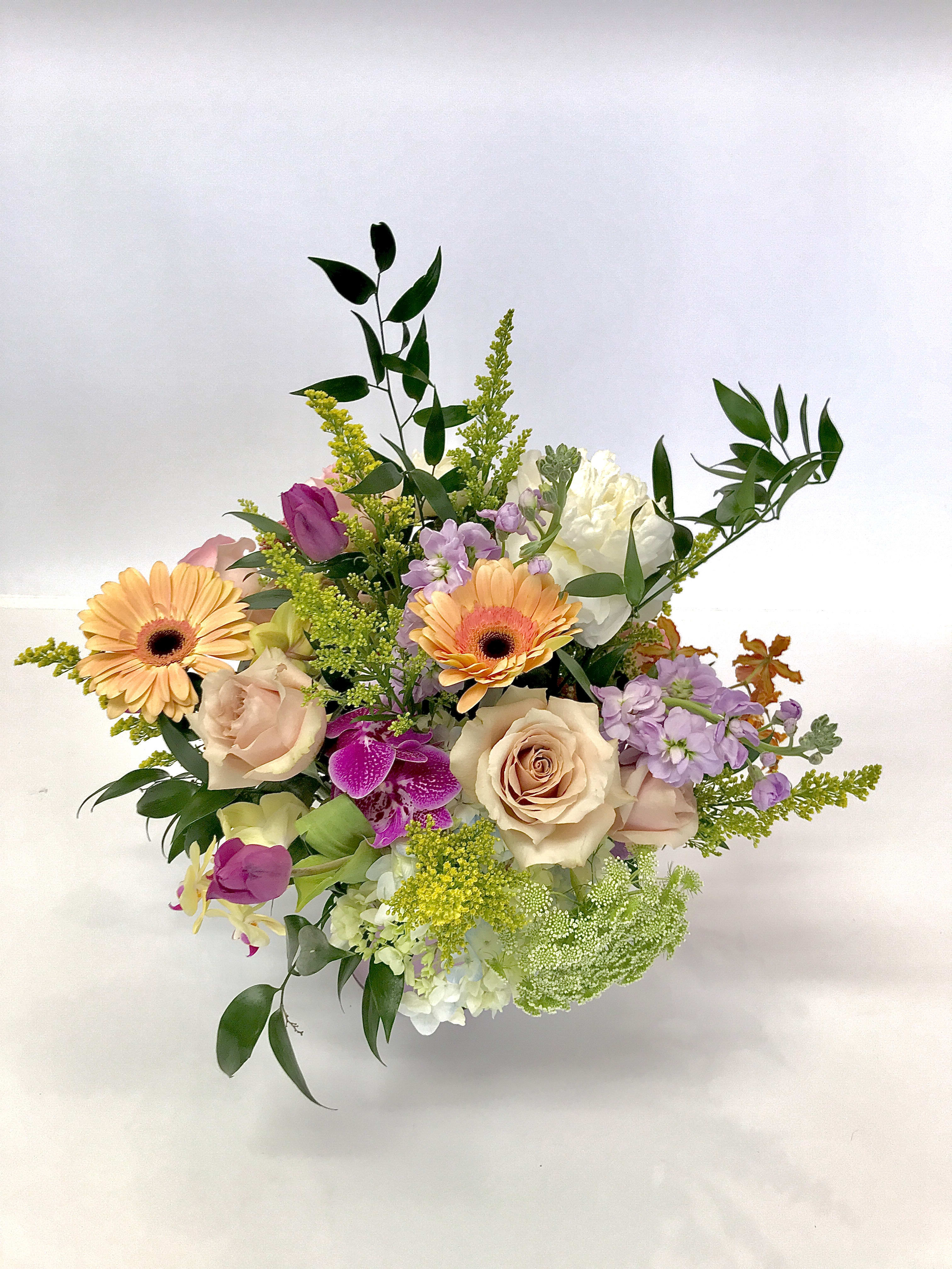 The Gamble Rogers  - A custom designed arrangement by Fairbanks Florist. A beautiful collection of mixed seasonal flowers that are fresh in our shop the day of delivery. We try our best to design something similar to what is pictured, but our shop does custom design - so each arrangement is a little different, but has the same spirit, beauty and freshness.  Your arrangement will be designed in the style shown but flowers and containers may be different from that pictured. Our designers make every effort to use the best floral selection of the day.