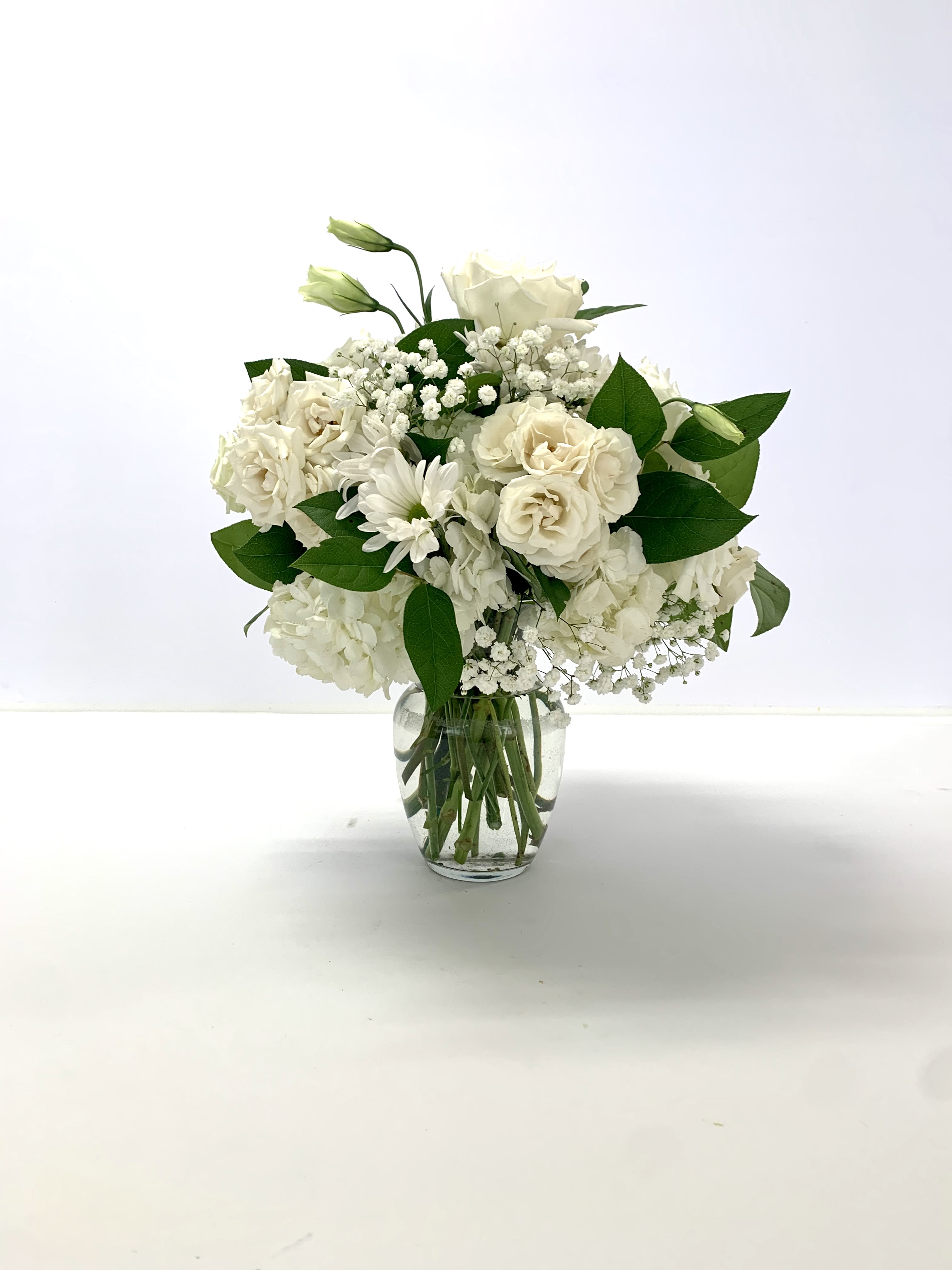 The Lee - A custom designed arrangement by Fairbanks Florist. Your arrangement will be designed in the style shown but flowers and containers may be different from that pictured. Our designers make every effort to use the best floral selection of the day.  We advise our customers to order 24-48 hours in advance of their scheduled delivery to ensure that we are able to have similar flowers and colors in the shop for their order. 