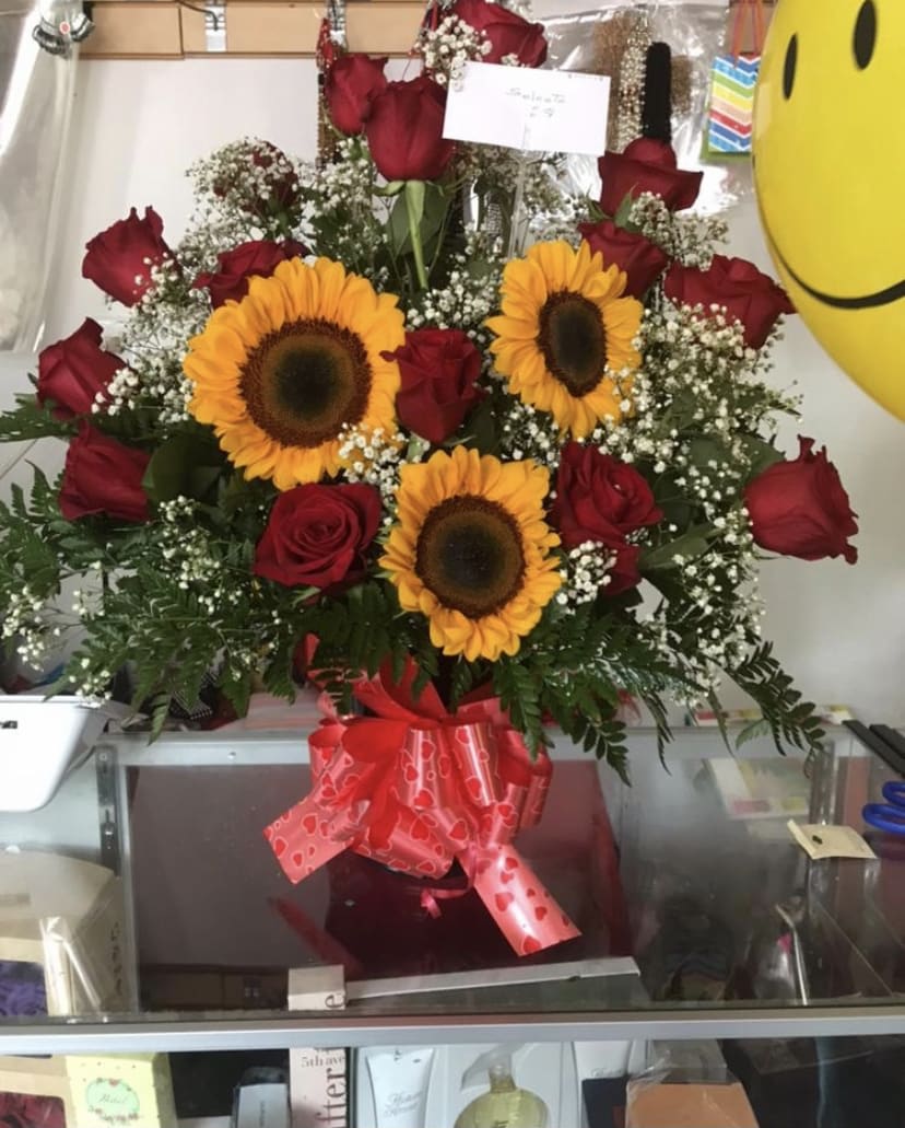 Red Roses &amp; Sunflowers to brighten your day  - This particular arrangement is combined with Red roses &amp; Sunflowers, baby’s breath and leather 