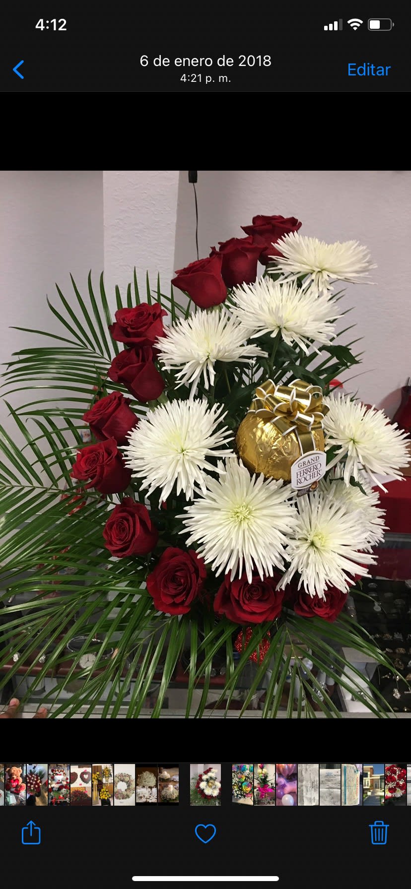 Spiral Form Red Roses  - Spiral red roses arrangement with chocolate and white spiders