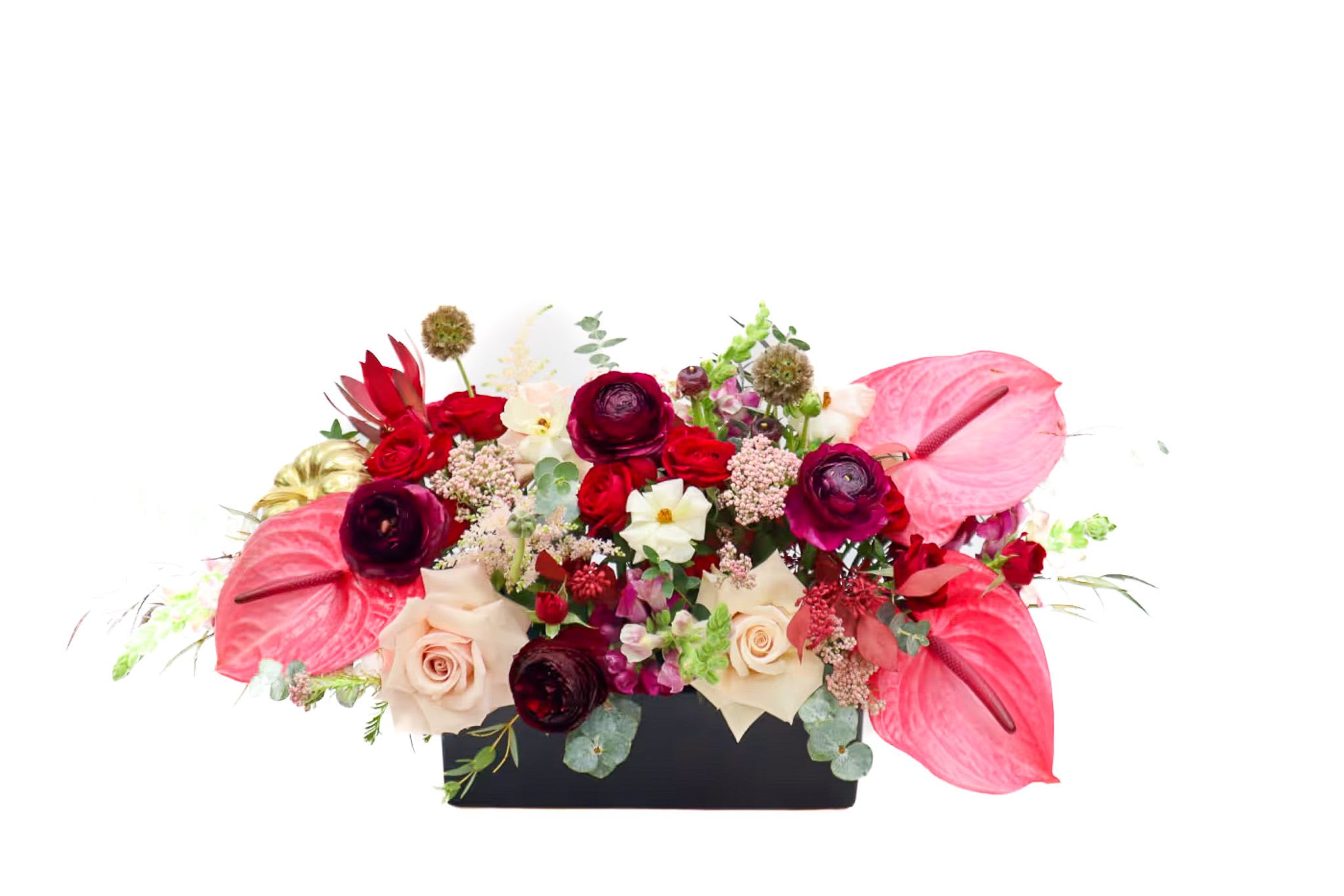 Mixed floral arrangement in a black rectangular container with pink anthuriums and roses