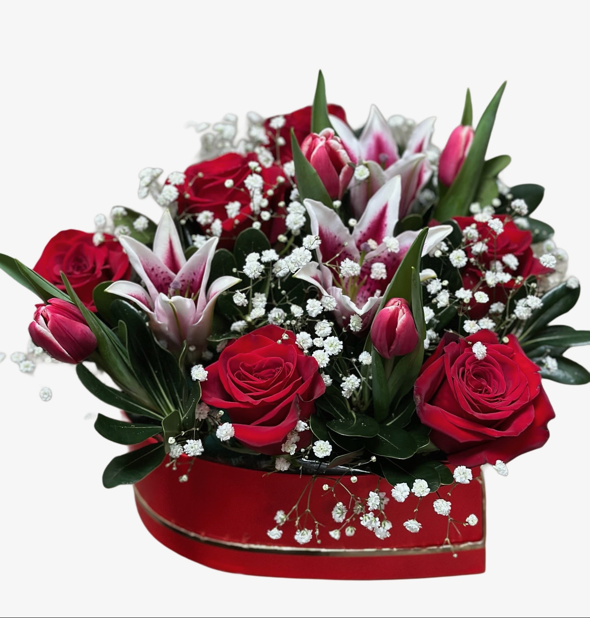 Heart-shaped box of red roses and pink lilies with baby's breath
