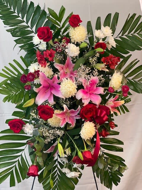 Standing floral spray with red roses and pink lilies