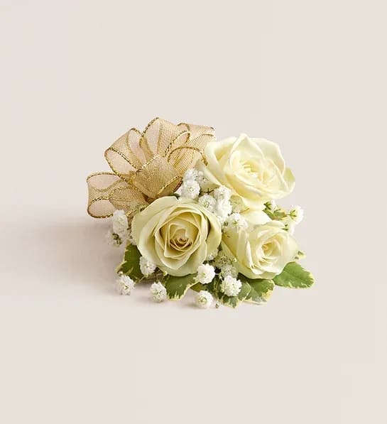 Small cream rose arrangement with gold ribbon and white filler flowers