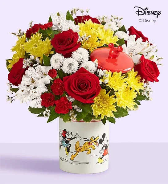 Bouquet of red, yellow, and white flowers in a Mickey Mouse vase