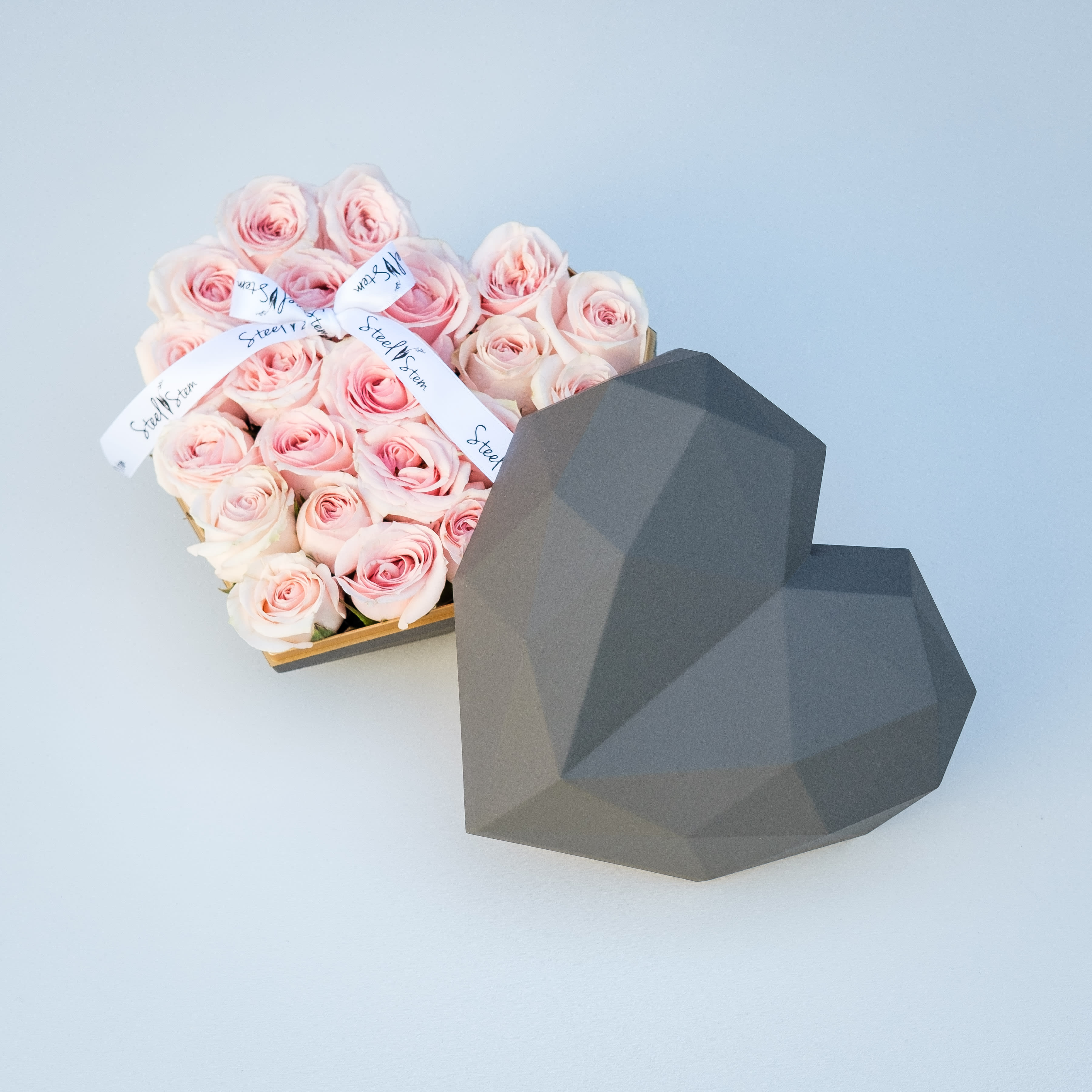 My BFF Gift Box - A luxurious heart shaped gift box is filled completely full of pretty in pink premium spray roses. Gift this gorgeous design and they can reuse there heart shaped box. Our heart gift box comes accented with our signature Steel Stem ribbon for an opulent finish.