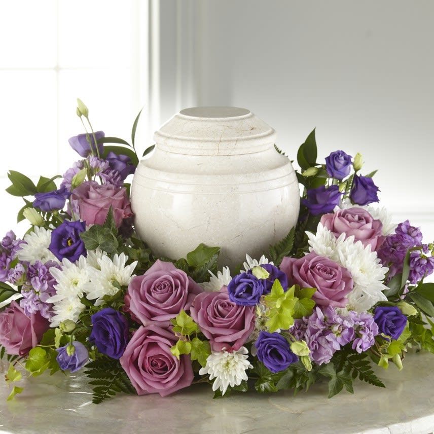 Purple and pink floral urn arrangement with white daisies