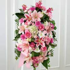 Pink and white floral standing spray with lilies and roses