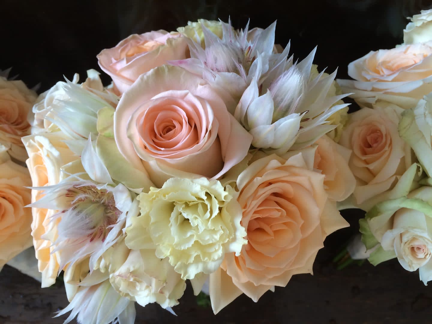 Bouquet of pale peach roses and cream flowers