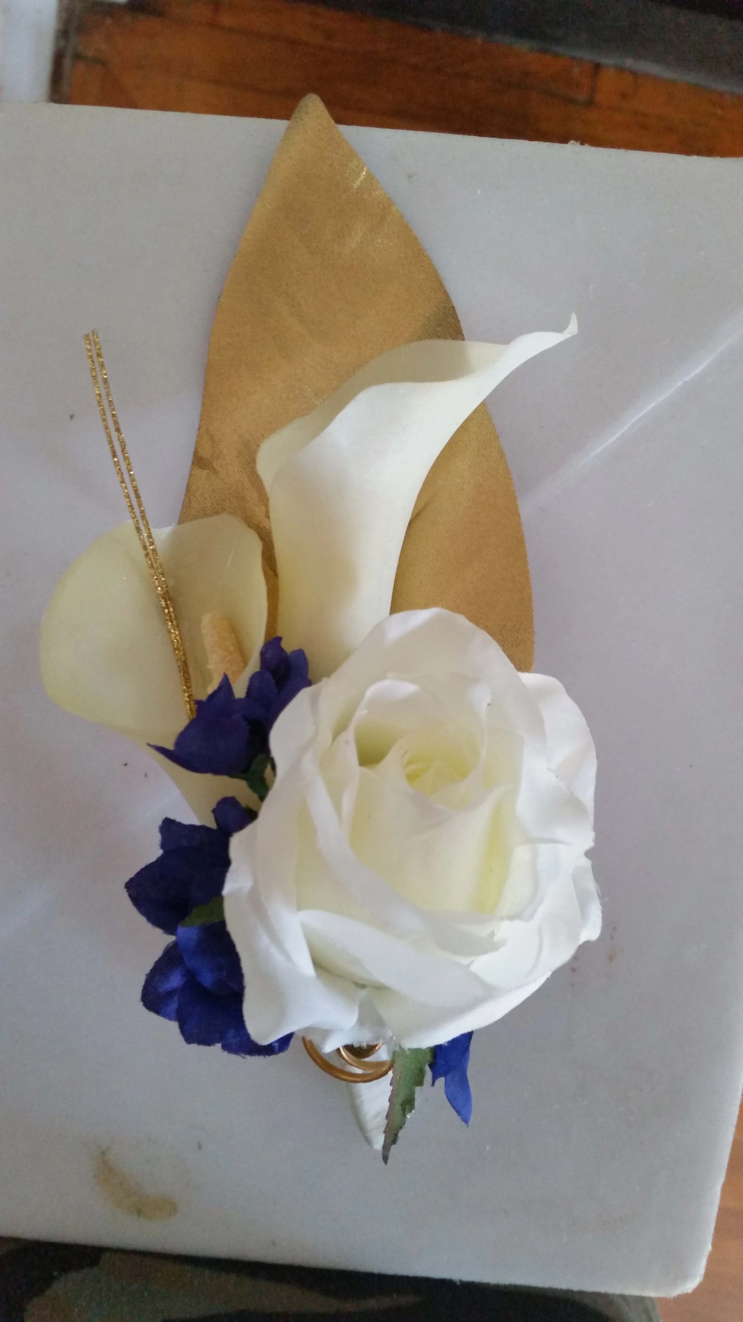 White rose with purple accents and gold decorative leaves