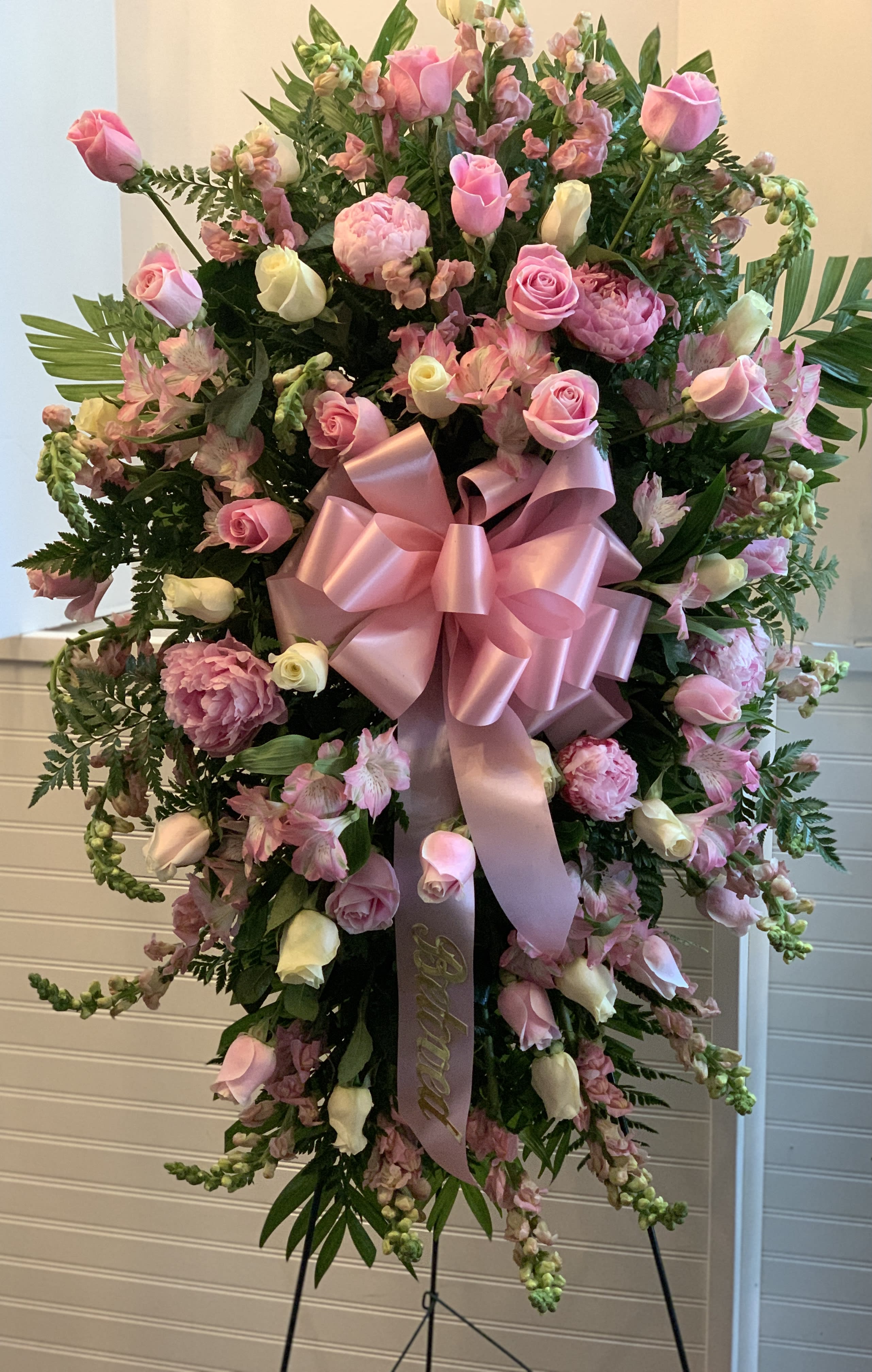 Pink Compassion - Pink roses, lilies, and more come together for a blushing pink standing funeral spray. 