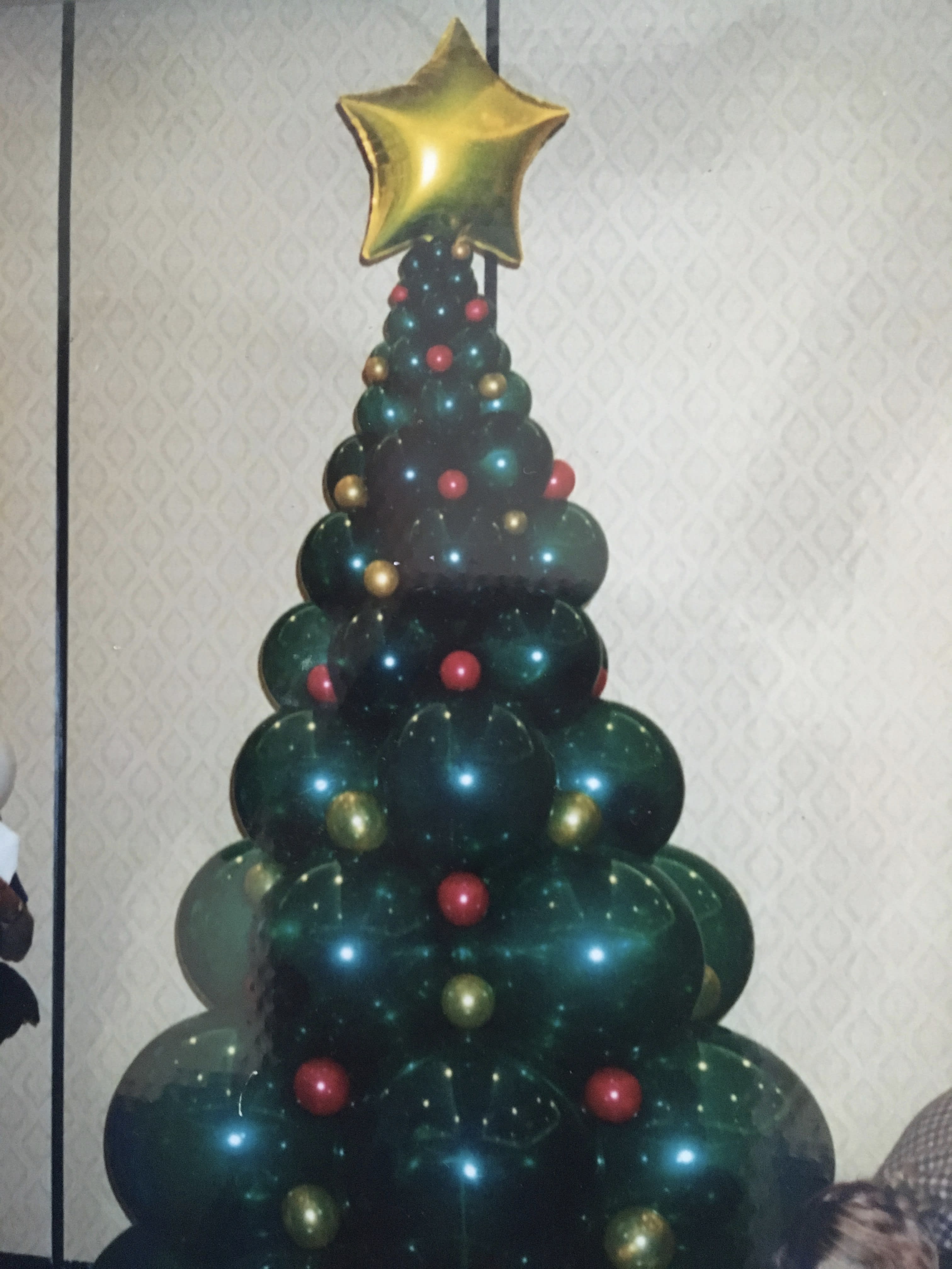 Balloon Christmas tree topped with a gold star
