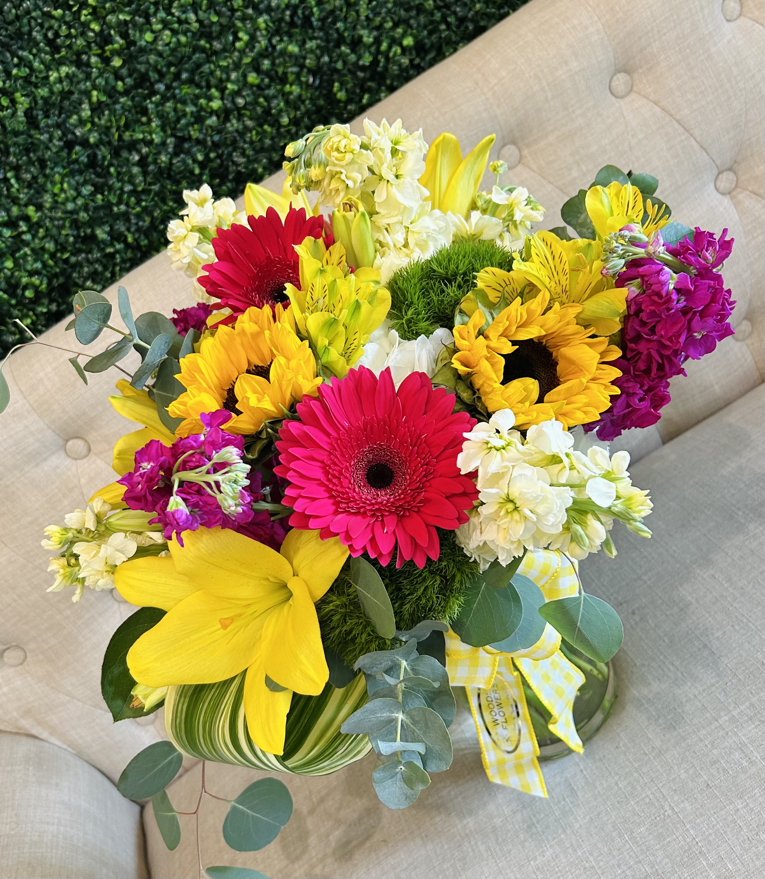 Bright mixed bouquet with gerbera daisies, sunflowers, lilies, and white blooms