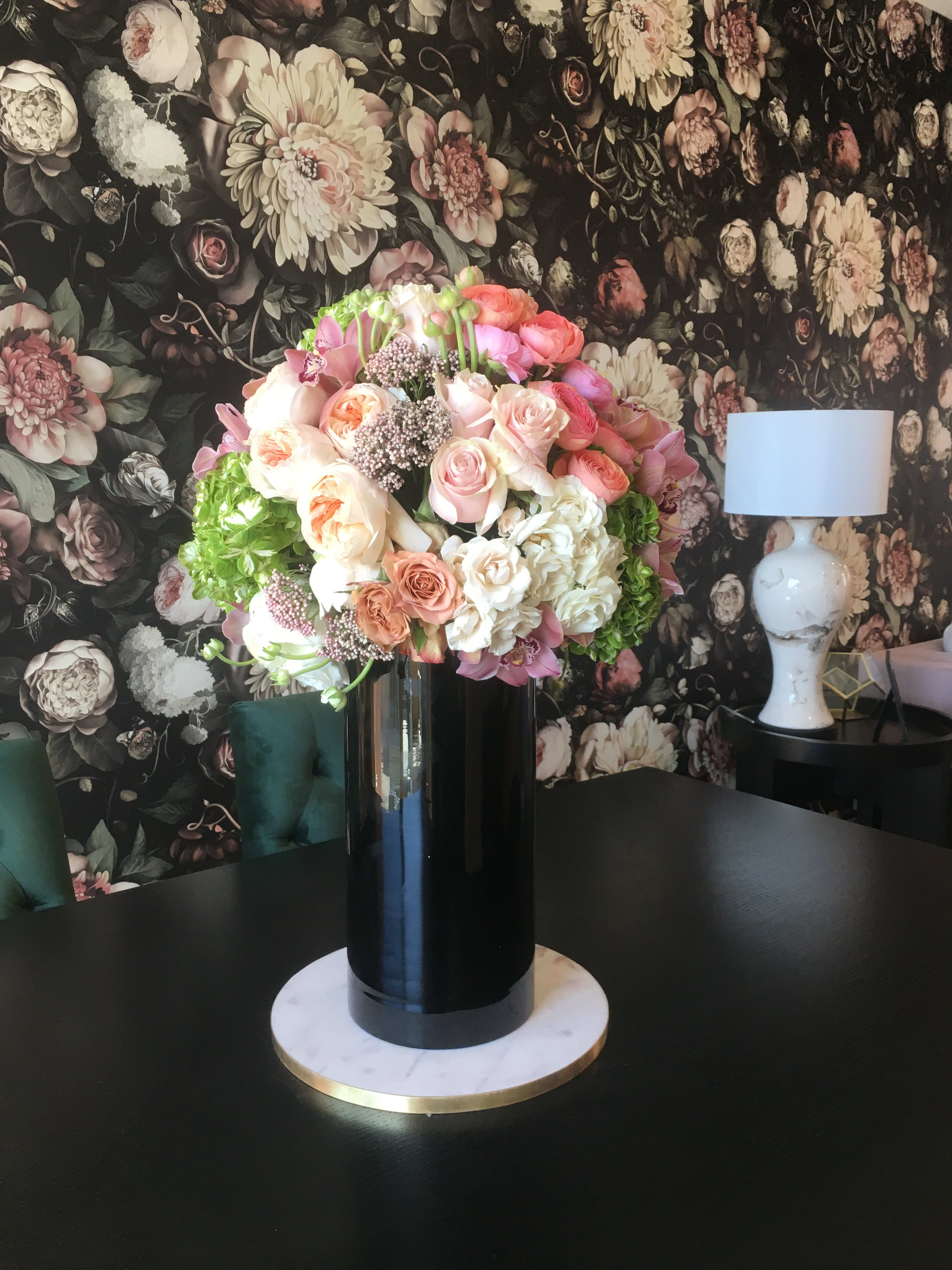 Flowers Match the Wallpaper - Black glass cylinder beautifully designed with blush, peach, and pink colored flowers