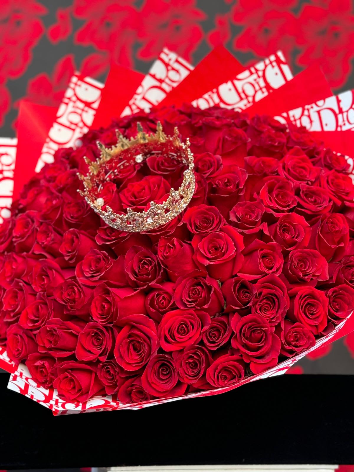 Fit for a Queen: 100 Roses - Imagine a stunning floral arrangement designed to leave an impression of grandeur and elegance, fit for a queen. This luxurious bouquet features 100 pristine roses, each hand-picked for its perfect form and vibrant color.