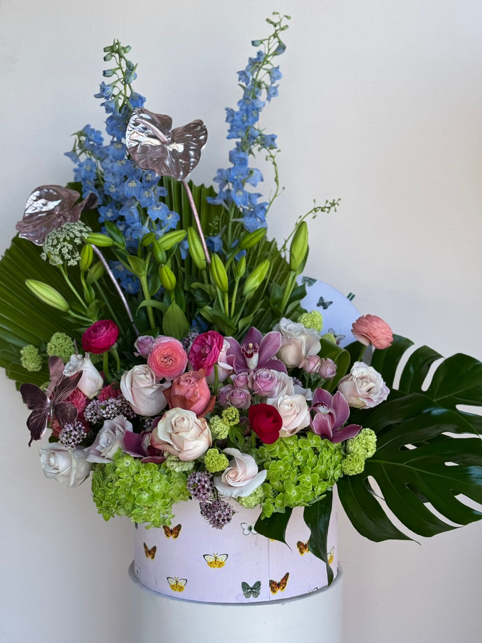 Butterfly Bloom - A whimsical arrangement inspired by the delicate beauty of butterflies, blending vibrant blooms and airy accents for a light, enchanting display.
