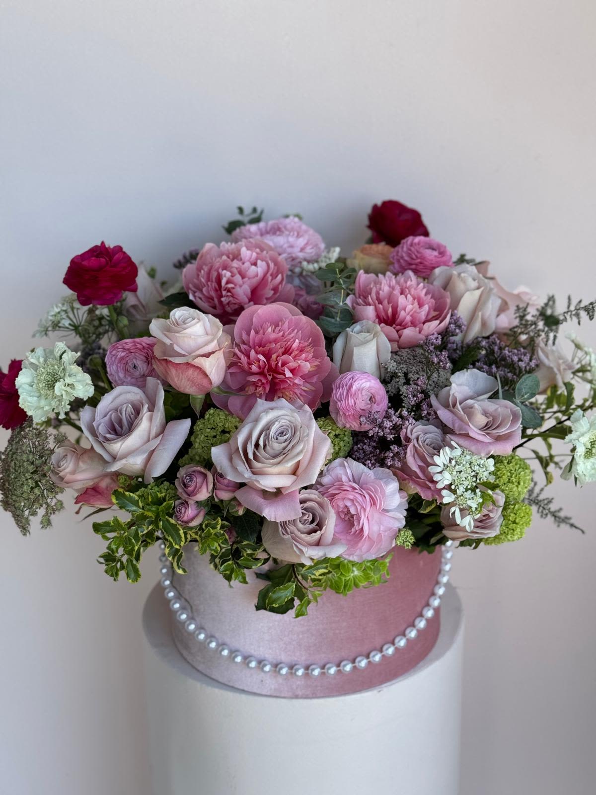 Pearly Pink  - A refined floral arrangement in soft pinks, adorned with elegant pearl accents—crafted to celebrate Mom’s timeless beauty and graceful love.