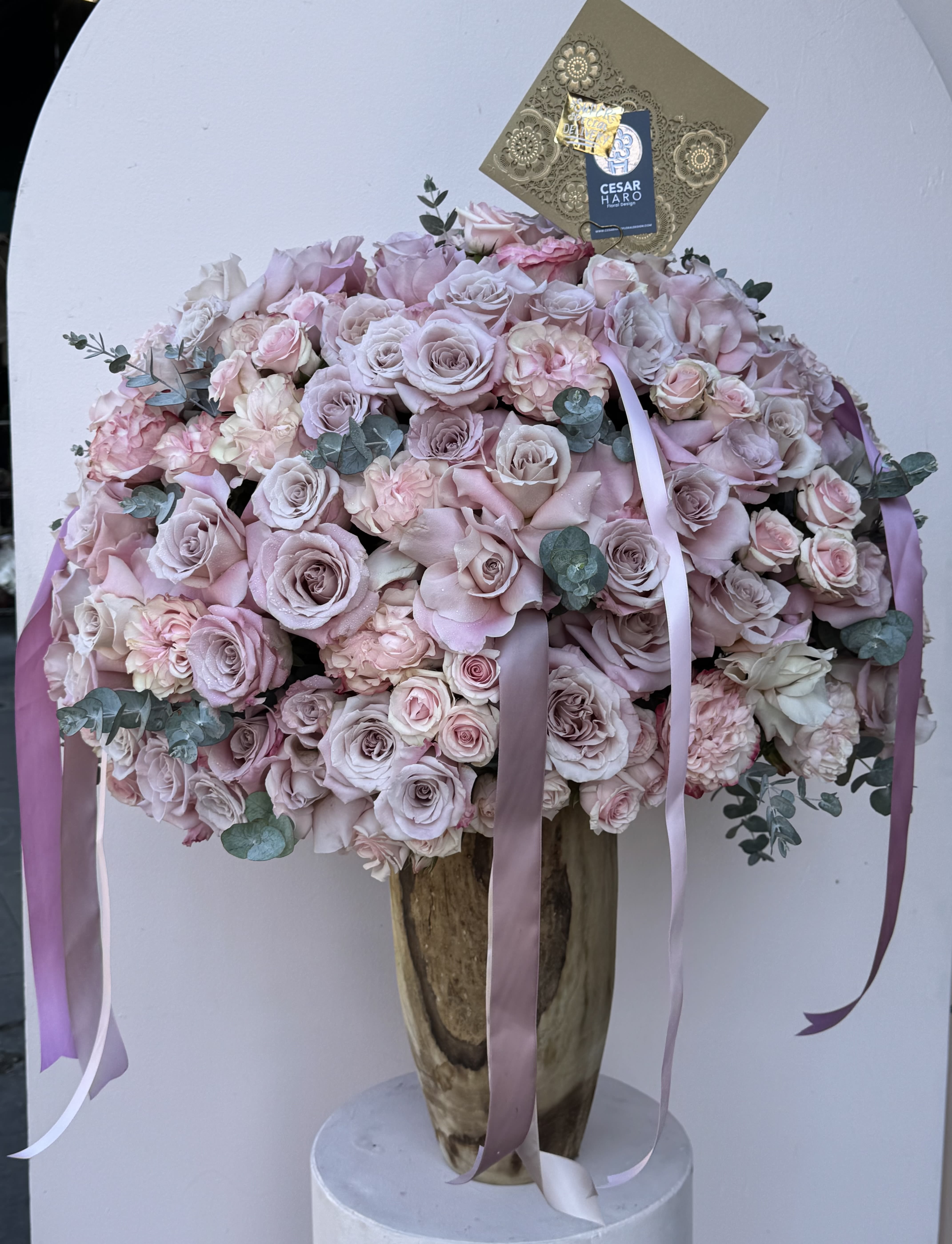 Forbidden Love - Floral arrangement filled with roses in a unique reusable wood vase. 